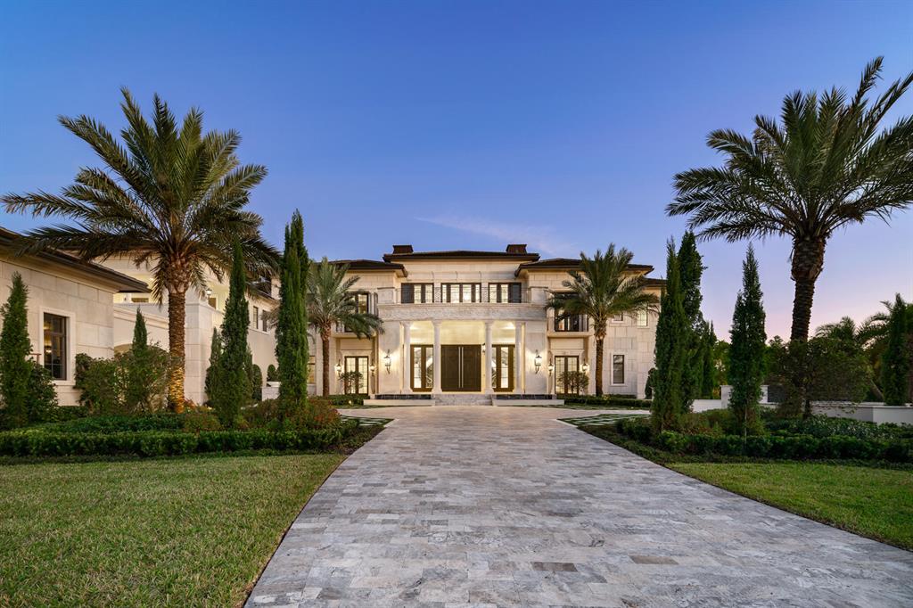 Rockybrook Estate in Delray Beach is an epic residential statement unlike anything seen in South Florida. Set in prestigious Stone Creek Ranch, an exclusive luxury community with only 37 estates, this 31,000-square-foot architectural marvel is an ode to both modern classicism and throwback glamour. In the same breath, the inviting seven-bedroom, 11-full-bath layout captivates with family friendly flourishes that double as entertainment spaces. It's the best of all worlds—sophisticated design, jaw-dropping detail and tangible warmth, flawlessly executed under one roof. Conceptualized by Brenner Architecture, Rockybrook dazzles at first dramatic sight with a grand foyer and custom-designed open-arms staircase that recalls a scene from a Hollywood classic. It's a hint at what's to come - one space after another that stirs the senses. A stately living room with marble flooring and 32-foot walls. A dining room that seats 16 with white agate backlit walls and white mother-of-pearl ceiling treatment. A glass-encased, temperature-controlled wine room. A Zen-like garden area with a waterfall treatment and koi pond. Original lighting fixtures by the likes of artists Dale Chihuly and Nicolas Terrain. A long hallway off the foyer eventually leads to a gourmet Downsview kitchen with state-of-the-art appliances; a striking double-column, stainless-steel range hood; and a separate island counter with seating for six and playfully oversized lighting. And that's not even the only place to prepare mealsRockybrook also boasts a separate commercial catering kitchen.
Upstairs, the master bedroom has its own separate wing, including a study lounge and kitchenette. The main balcony of the suite features a fireplace, whirlpool bath and sun deck, all overlooking the property's lush 2.5 acres and unrivaled outdoor spaces. Exquisite details also abound in the master baths; hers is adorned with amethyst and boasts a center bathtub with a hanging crystal chandelierand both baths have their own balconies. 
For all of its eye-catching opulence, Rockybrook also manages to enchant with a resort-like vibe that makes every day feel like a getaway. Look no further than the 250,000-gallon heated pool with black mosaic glass waterline tile and a black Pebble Tec finish, an ode to the infinity-edge splendor at Wynn Las Vegas. The tropically landscaped pool areacomplete with waterfalls, fire pits, a covered pavilion and dining area, a grotto with a rain feature, and a fully equipped summer kitchenprovides an entertainment epicenter for all seasons. But that's hardly the only place to play at Rockybrook.
The estate also features a club room with a bar, card table and billiards table; a cigar room; a cinema-style theater roomand even a two-lane bowling alley in the massive children's lounge. Rockybrook also sports health and beauty areas, including a spa treatment room, salon, gym and sauna, a championship tennis court, and a blissful meditation space overlooking the tropical garden. 
The residence also is designed with hurricane-resistant windows, doors and exterior construction. In addition, it comes with a Creston smart home system and security cameras.

Welcome to Rockybrook Estate - an American original.