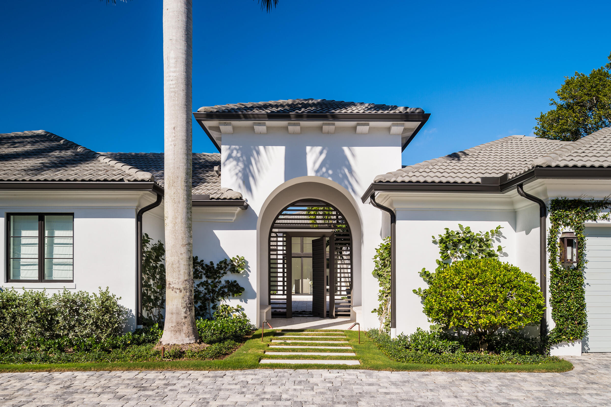 This perfectly re-imagined home will offer you, your family and friends a relaxing dream retreat.  A popular courtyard stye home where the outdoor space connects to almost every room through a multitude of sliding and French doors, and tucked in a corner, a hedged alcove offers a fireside nook with a cozier atmosphere.  Once inside the style is a warm, modern palette that was carefully curated to not be too clinical or fussy.  Some features include beautiful Oak Wood Floors, Thermador Appliances, Private Master Suite with heated bathroom floors, Gas Heated Pool and Spa, Sound System and Complete Hurricane Impact Doors and Windows.  A must see.