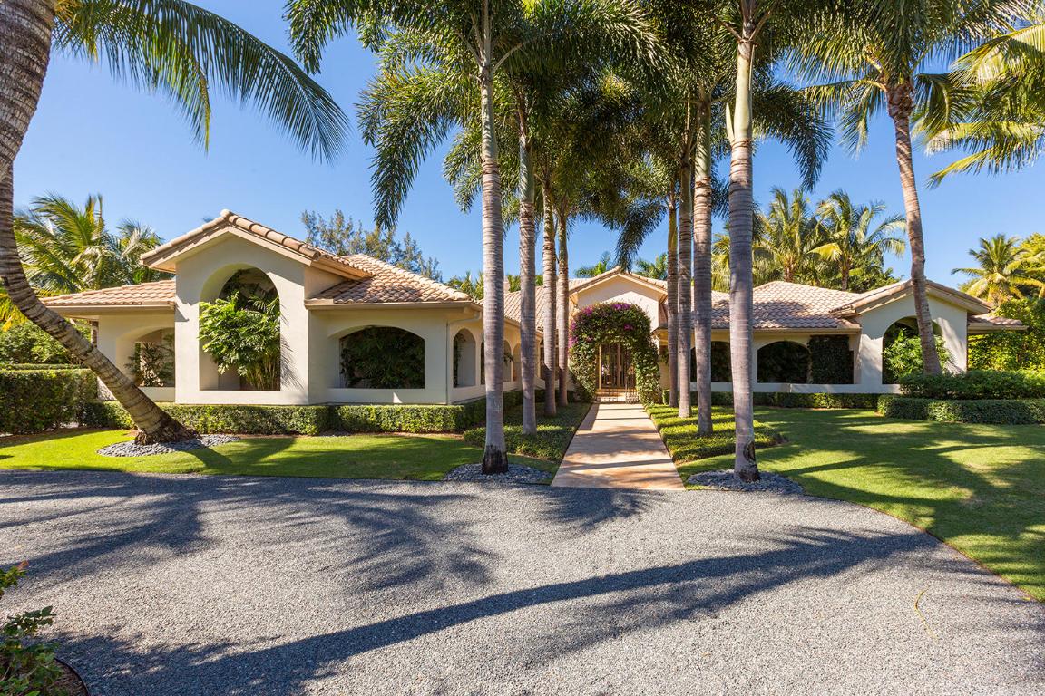 A strong sense of privacy defines this extraordinary one-plus acre estate home. One of the largest properties in Palm Beach Polo perfectly situated on a hidden cul-de-sac, there is a serenity the moment you enter. An open floor plan for effortless entertaining on a large scale, but with the clearly defined spaces needed for everyday comfortable living. This home is wired and equipped with smart technology. There is a large professionally appointed kitchen, complimented by a neighboring catering kitchen, a cozy media room and exceptional outdoor living spaces. The private and completely protected expanse of lawn punctuated with bougainvillea , jasmine and citrus trees is perfect as-is or could be the setting for a sublime guest house. This special property has no equal.