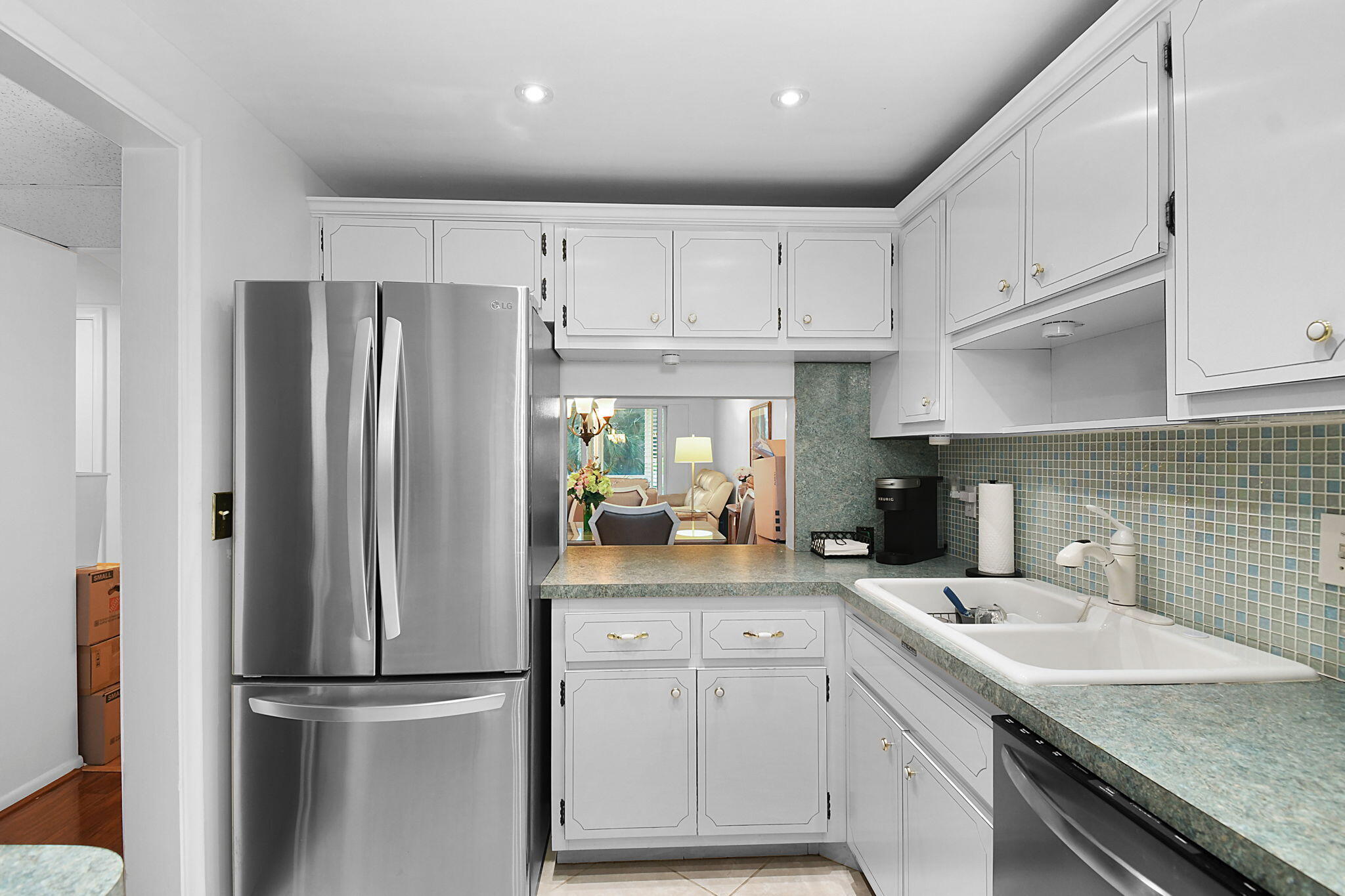 BUYER'S FINANCING FELL THROUGH!  SELLER PAID ASSESSMENTS! Spacious and updated 2/2 minutes from the beach, airport, museum, aquarium, and all of the retail, restaurants, etc. that US 1 has to offer!  LOW HOA fees for the area!  Updated kitchen and baths, real wood floors, NEW IMPACT WINDSS on an updated balcony which is under air.  Come take a look at this sweet gem with amenities to enjoy! Pool, clubhouse, shuffleboard, BBQ grills, library, exercise  equipment, car-washing station, sewing room...etc.  Enjoy the numerous activities that are offered here - game nights, parties, etc!