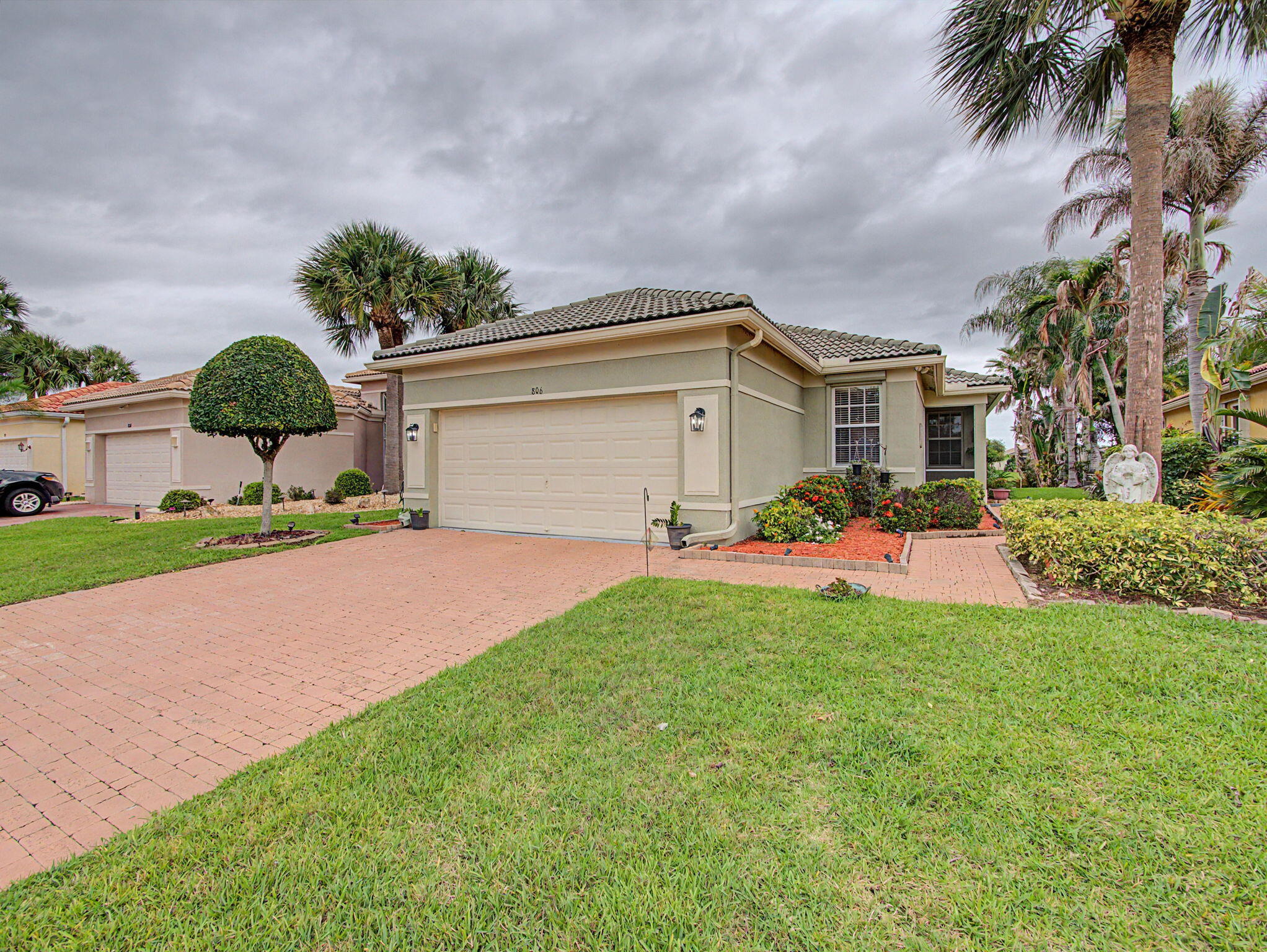 Welcome to this immaculate, lovingly maintained lakefront home in the highly sought-after St. James Golf Club community. Offered by the original owner, this comfortable and serene 3-bedroom, 2-bathroom, 2-car garage residence showcases pride of ownership throughout its 1,473 square feet of living space.  From the screened front entry to the screened rear lanai overlooking the peaceful lake, this home offers the perfect blend of indoor and outdoor Florida living. Inside, soaring vaulted ceilings and abundant natural light create an open and inviting atmosphere.  The beautifully renovated kitchen features granite countertops, light wood cabinetry, stainless steel appliances, and ample space for cooking and entertaining. The guest bathroom has been tastefully updated with premium finishes.  Including elegant LED accent lighting around the room and fixtures, creating a spa-like experience.  Enjoy tranquil water views, comfortable living spaces, and a home that has been meticulously cared for and maintained. Whether relaxing on the screened porch, entertaining guests, or enjoying the peaceful surroundings, this property offers a lifestyle of comfort and convenience.  Residents of St. James Golf Club enjoy an active all-ages community with outstanding amenities including a fitness center, resort-style pool and spa, pickleball courts, tennis courts, golf, bocce ball, playground, picnic area, and sports field. The HOA includes lawn care, cable, high-speed internet, and security, providing exceptional value and convenience.  Ideally located just minutes from downtown Fort Pierce, shopping, dining, and the beautiful beaches of Hutchinson Island, this exceptional lakefront home is the perfect place to enjoy the Florida lifestyle.