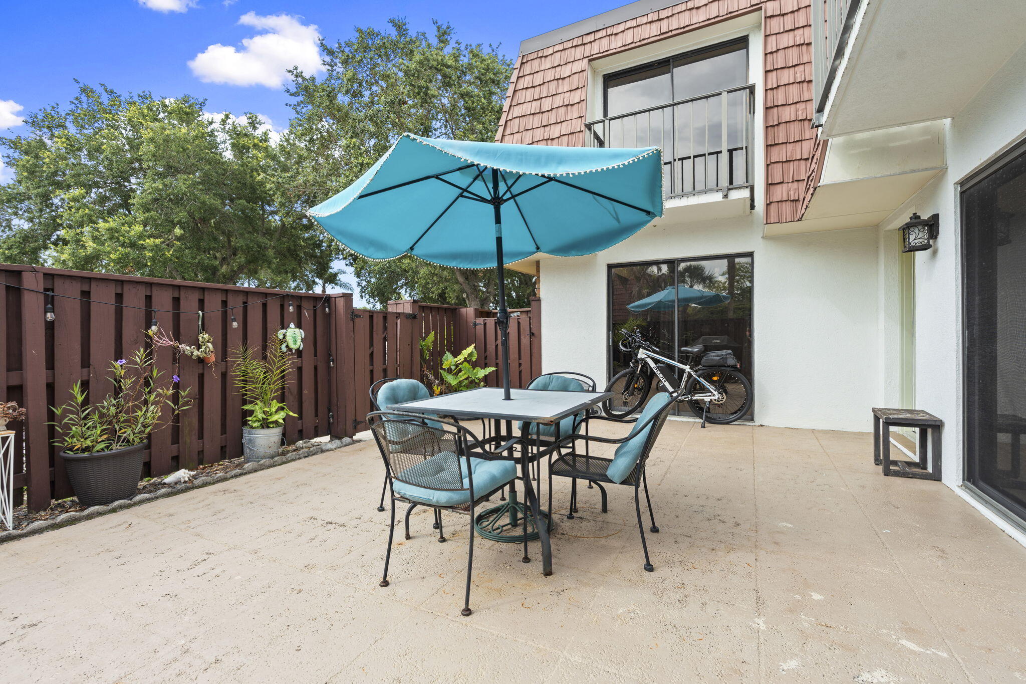 Welcome to this charming 2-bedroom, 2.5-bath corner-unit townhouse located in Sunset Trace at Martin Downs.  This well-maintained home offers a spacious layout and a private patio perfect for relaxing or entertaining. Situated within a gated community, residents enjoy added security and peace of mind. The corner-unit location provides extra privacy and an open feel. Conveniently located near top-rated schools and major commuter routes. Enjoy comfortable, low-maintenance living in one of Palm City's most sought-after communities.