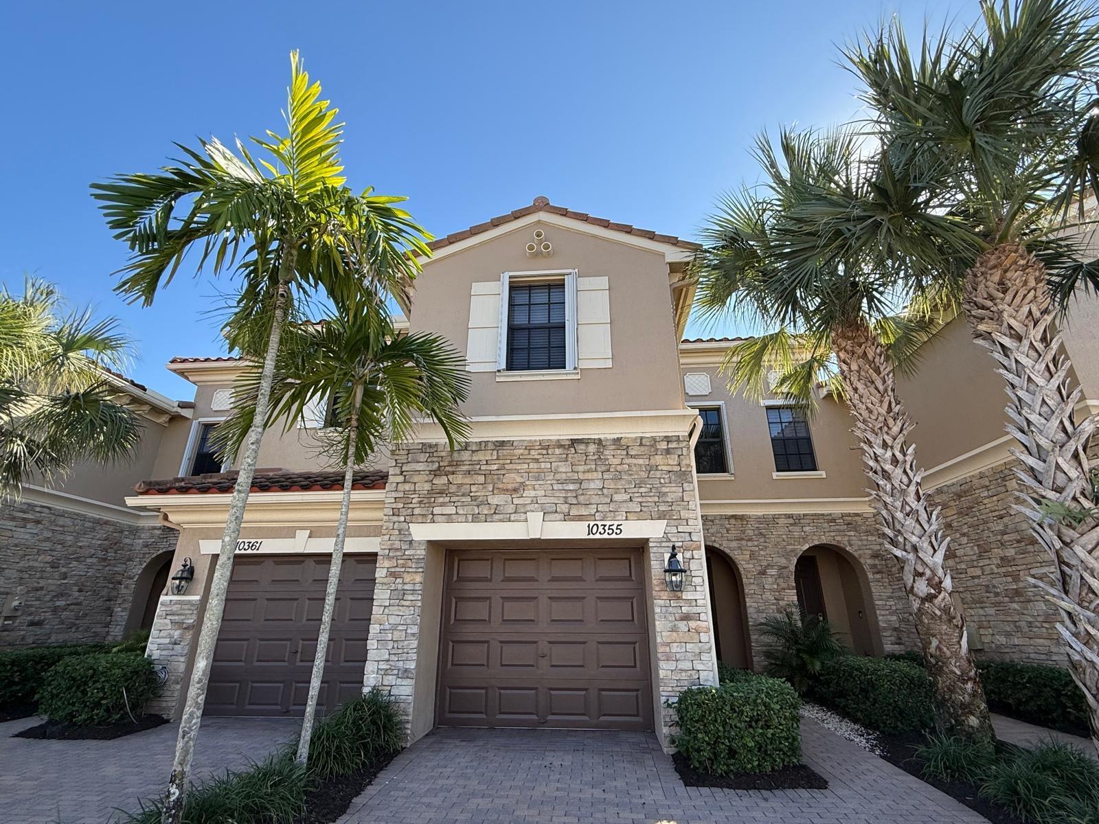 Step into this beautifully maintained 3-bedroom, 2.5-bath townhome nestled in a gated, well-kept community. Nice Lake View. The spacious primary suite offers a luxurious retreat, complete with a massive walk-in closet and a roomy bathroom featuring a roman tub and private water closet. Upstairs, you'll also find the laundry room, two additional bedrooms, and a full guest bath. The stylish kitchen boasts granite countertops, a generous island, and stainless steel appliances—perfect for both cooking and entertaining. HOA fee includes exterior building maintenance (including roof) and upkeep of common areas. Ideally located near State Road 7, Wellington Green Mall, and a variety of dining and shopping options.