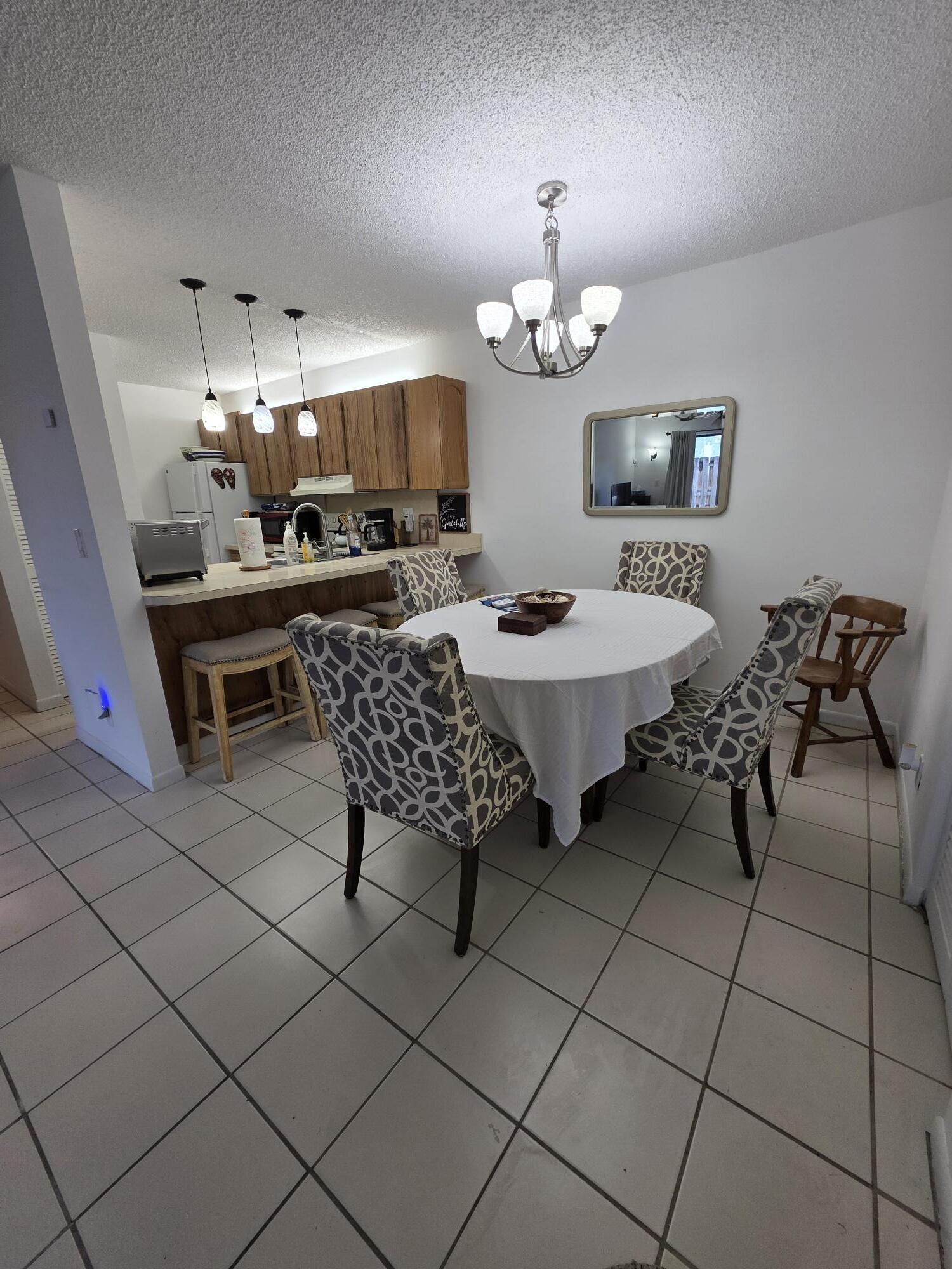 Welcome to Palm Beach Gardens' hidden gem! This 2/2 spacious home in a quiet community features all the amenities; 1000 sq feet of lovely furnished living that includes an in-unit washer and dryer, dishwasher, private patio, and master bedroom walk-in closet. New tile in the bedrooms and family room brighten up an already lovely space. This community located only 7 minutes from PB Gardens Medical Center offers tennis courts, a beautiful pool and a jogging path. Right in the heart of the shopping district with small shops and restaurants around the corner and Gardens Mall 5 minutes away - plus 15 minutes from the best beaches. Move-in ready.  Seasonal rental available. Seasonal rental is available for a minimum of six months with landlord approval and increases the rental amount to $2,300/month.