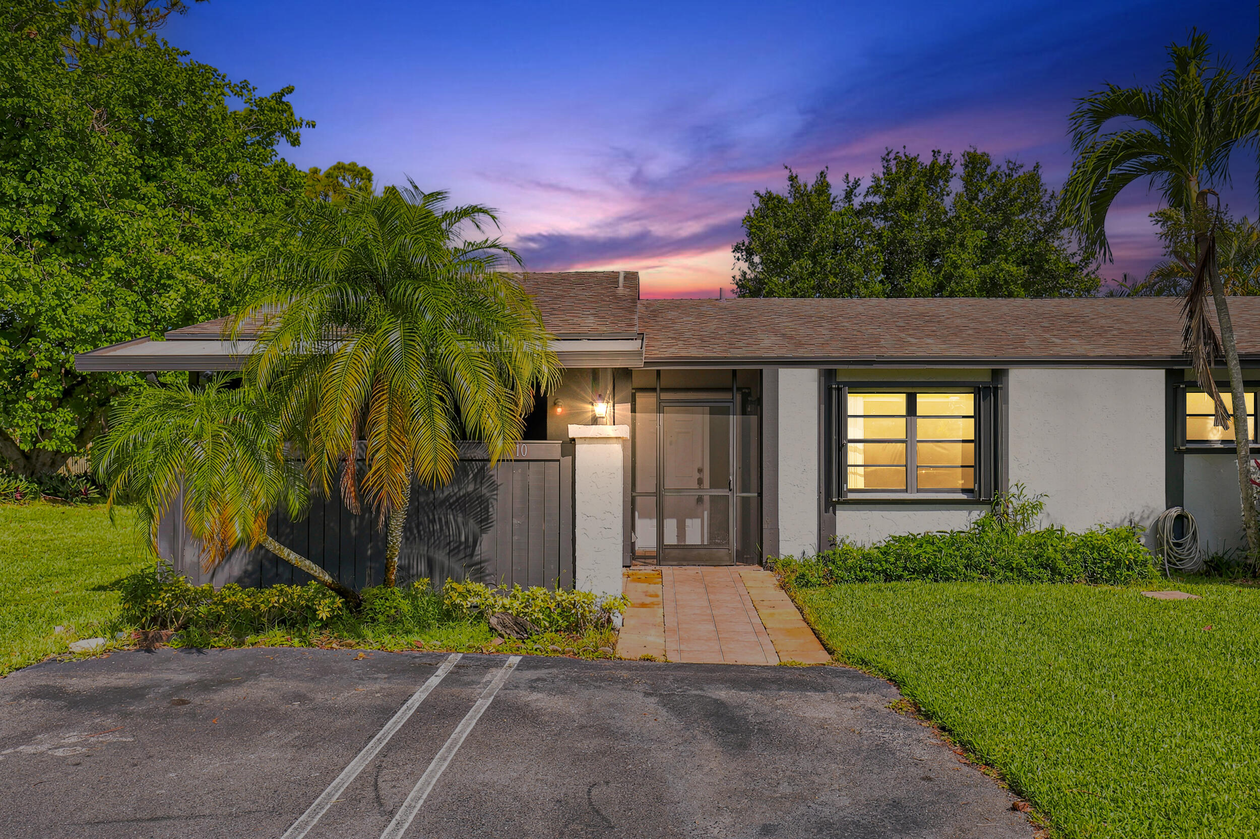 STOP RENTING! Opportunities like this are getting harder to find. This move-in ready corner villa offers 3 bedrooms, 2 bathrooms, a renovated kitchen, fresh interior paint, tile floors throughout, and hurricane protection for added peace of mind. Enjoy the privacy of a one-story layout with two assigned parking spaces right outside your door, plus open green space just steps away. The HOA is only $285/month and includes roof replacement, helping keep long-term ownership affordable. Residents also enjoy a community pool and beautifully maintained grounds. FHA and VA buyers are welcome, making homeownership more attainable than ever. If you've been waiting for the right opportunity to own instead of rent, this is one you won't want to miss.