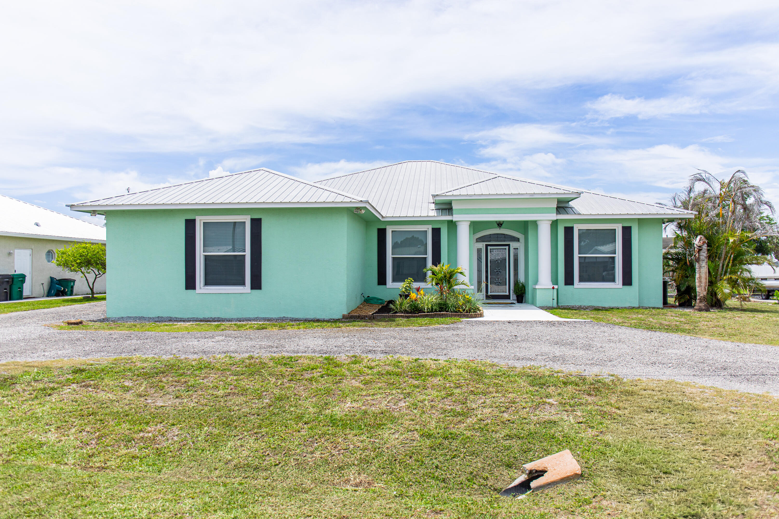 If you've been looking for a home with access to the water, this one is worth a look! Located in Taylor Creek Isles, this 3-bedroom, 2-bathroom home offers a split floor plan with plenty of space to spread out. The huge screened-in back porch is the perfect spot to enjoy your morning coffee, relax in the evenings, or entertain family and friends. There's also a 1-car garage and a private dock with access to Lake Okeechobee, making it easy to enjoy boating, fishing, and everything waterfront living has to offer. Whether you're looking for a primary residence or a weekend getaway, this home has plenty to offer.