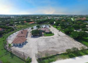 LOCATION, LOCATION, LOCATION! 3.6 ACRE HORSE FARM IN SADDLE TRAIL PARK ON THE SOUTH SIDE OF GREENBRIAR - DIRECTLY ACROSS FROM WEF. ON THE BRIDLE PATH - 3 MINUTE HACK TO PIERSON HORSE CROSSING. BEING SOLD ''AS-IS''. THE STABLE & DETACHED GROOMS QTR'S ARE BUILT BUT JUST NEED THE FINISH WORK COMPLETED. THE RIDING ARENA SPACE HAS BEEN PREPED FOR THE INSTALLATION, CHOOSE THE FOOTING YOU DESIRE.  THE BARN IS A CENTER AISLE WITH A CROSS AISLE WITH 14 STALLS (ALL 14'X12') WITH TACK ROOM & TWO WASH RACKS. ADJACENT TO THE BARN ARE TWO MORE WASH/GROOMING STALLS WITH LAUNDRY FACILITIES, FEED & HAY STORAGE.  THE GROOMS QTR'S IS 3BR/2BTH WITH FULL KITCHEN, LIVING ROOM & EAT-IN AREA. ONE BATHROOM IN THE GROOMS QTRS HAS A SEPERATE SHOWER & ROMAN TUB AND THE OTHER A SHOWER STALL.  THE HOME NEEDS UPDATING. THE MAIN RESIDENCE NEEDS UPDATING BUT HAS GREAT SPACE AND LIGHT.  LARGE ROOMS AND OPEN FLOOR PLAN WITH A LARGE MASTER SUITE.  THE MASTER HAS 2 LARGE WALK-IN CLOSETS, DUAL VANITIES, SPA TUB, WATER CLOSET WITH BIDET.  THE HOME BOASTS FRENCH DOORS,  A 3 CAR GARAGE, LARGE POOL & SPA.  A PRIME LOCATION WAITING FOR SOMEONE WITH VISION TO COMPLETE THE PROJECT.  THE END RESULT WILL BE A FUNCTIONAL AND STUNNING ESTATE ONLY MINUTES TO THE HORSE SHOW.