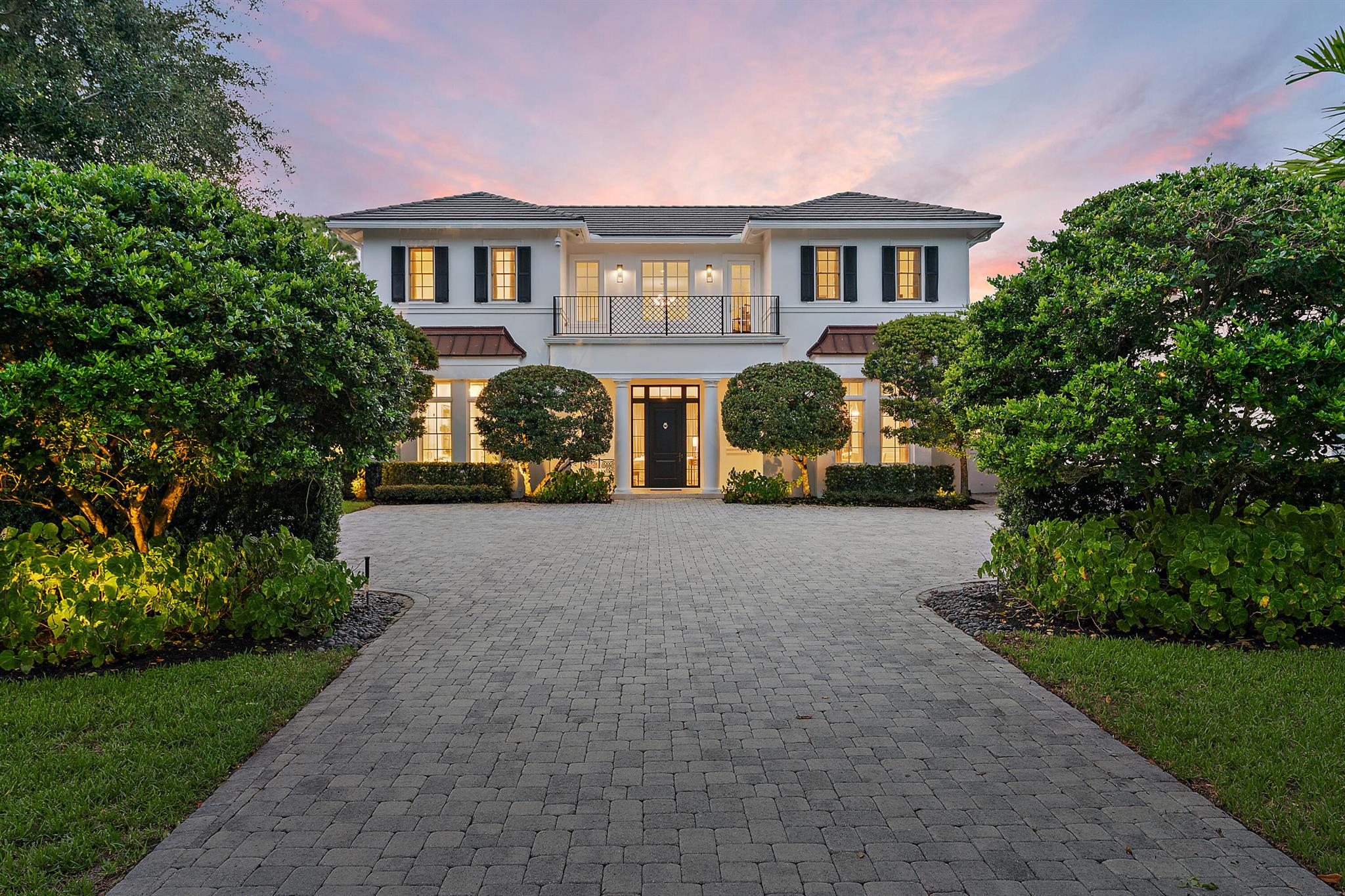 Exclusive 5,800sf+ property situated in the private Steeplechase neighborhood, sitting on 1.25 acres, and featuring 5 beds and 6.5 baths. This home beautifully combines stylish transitional design with the feel of West Indies architecture and includes an outdoor oasis perfect for entertaining or relaxation. The attention to detail, endless house updates inside and out with bright, open and spacious rooms characterize this exceptional home. Outside find the custom newly finished oversized PebbleTec pool and spa, quartzite outdoor kitchen and Lanai equipped with outdoor lighting. Inside offers high ceilings, grand interior spaces, defined by walls of windows and designer accents throughout. The open layout flows with ease creating an irresistibly tranquil ambience. First floor includes casual and formal living spaces, formal dining and chef's kitchen equipped with high end Viking and Bosch appliances, oversized Calacatta marble island, double sinks and dishwashers. Continue on the first floor to find a private home office, guest room, laundry and primary suite with his and her closets and baths. Equally impressive, upstairs you'll find 3 additional bedrooms with en-suites and a casual loft space to enjoy. State of the art amenities include Control 4 system, electric window shades, newly finished epoxy garage floor, central vac, interior & exterior lighting and much more!