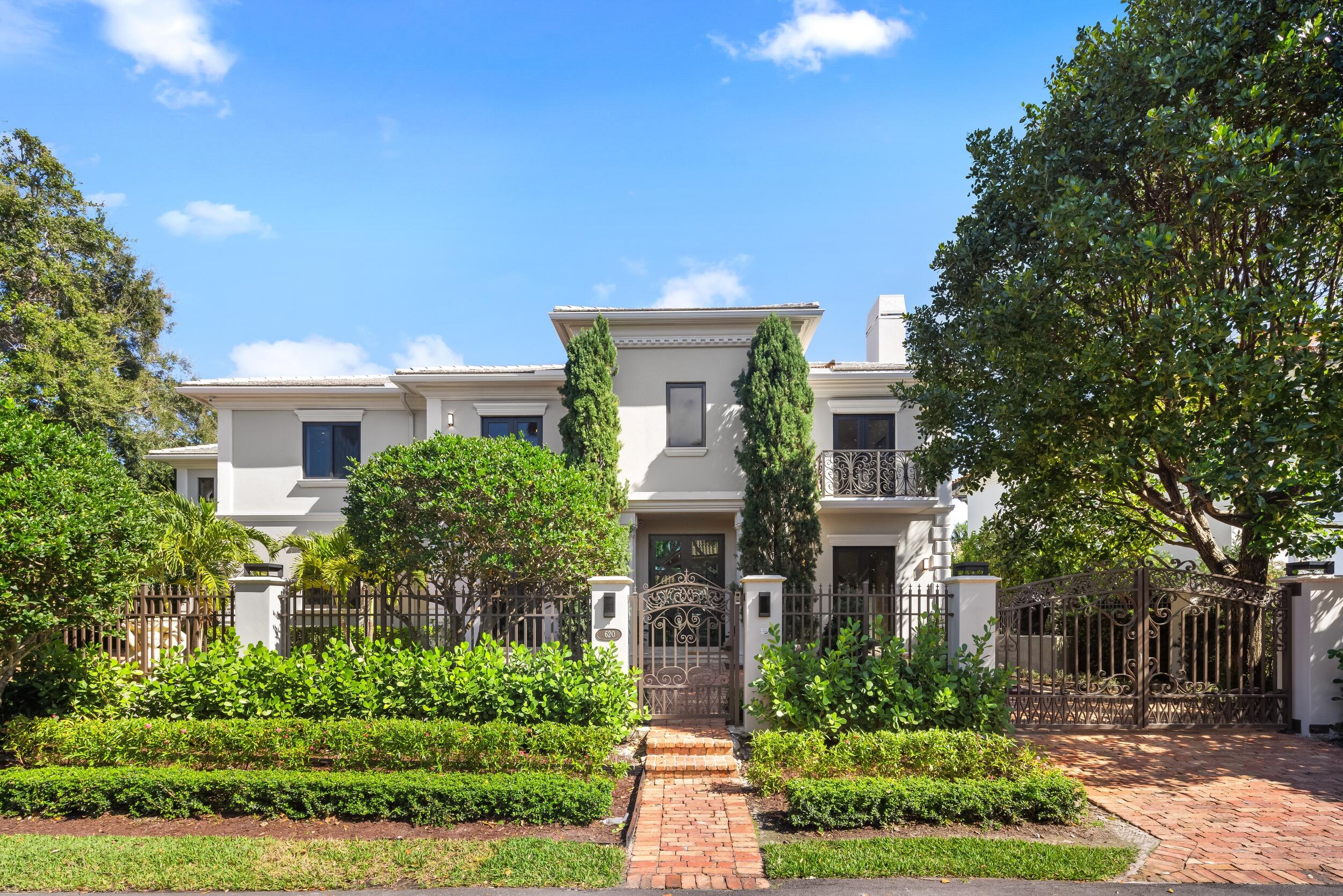 Discover a Georgian-inspired waterfront estate in prestigious Las Olas Isles, where timeless elegance meets modern luxury. Privately gated and set on 100' of water frontage with quick Intracoastal access, this residence is surrounded by lush, resort-style grounds. Marble floors, Cristallo accents, and bespoke chandeliers elevate refined interiors. The chef's kitchen showcases a custom brass hood & oversized island, while a dramatic 3D backlit Corian feature wall defines the great room. The primary suite offers a fireplace, sitting area, luxurious dual baths, expansive closets and private terrace. Outdoor living includes a pool, guest house, and serene entertaining spaces—just moments from Las Olas Blvd dining, shopping and the beach. Quick and easy access to the ocean for the avid boater.
