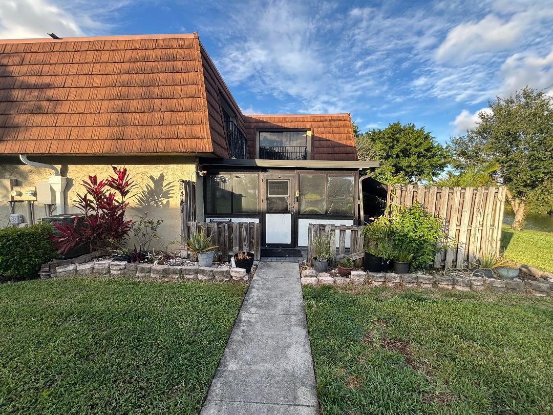 Come and see this 3 bedroom, 2.5 bathroom waterfront townhome, 3rd bedroom is downstairs and is a conversion of the living room easily converted back is you desire. Two bedrooms upstairs have their own full bathrooms. Kitchen is open to the dining area. Screened patio in front adds room and so many uses. Community has a pool and playground. This unit is on the canal. Close to schools , shopping , parks and Sawgrass Expressway.