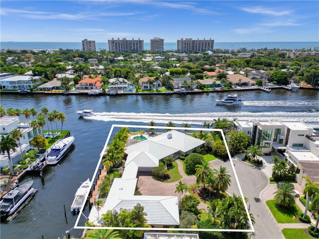 Incredible opportunity to own one of the largest waterfront lots in Fort Lauderdale with 25,094 sq feet of land. Spectacular "Point Lot" on the Intracoastal waterway plus adjacent lot to the west combined into one lot. Subdivide and build two homes (buyer to verify independently). Approximately 205' on the side canal and 140' on the Intracoastal. Beautiful newer homes next door and across the canal. The Landings neighborhood sits among the higher elevation points of Fort Lauderdale. Close to Pinecrest (plus many other great schools), and the beach (especially Lauderdale By The Sea). While this is being marketed at land value the existing home offers excellent square footage on a single level (6003 sq feet), a total of 4 garage spaces, and a dedicated guest house with 1 bedroom and 1 bath