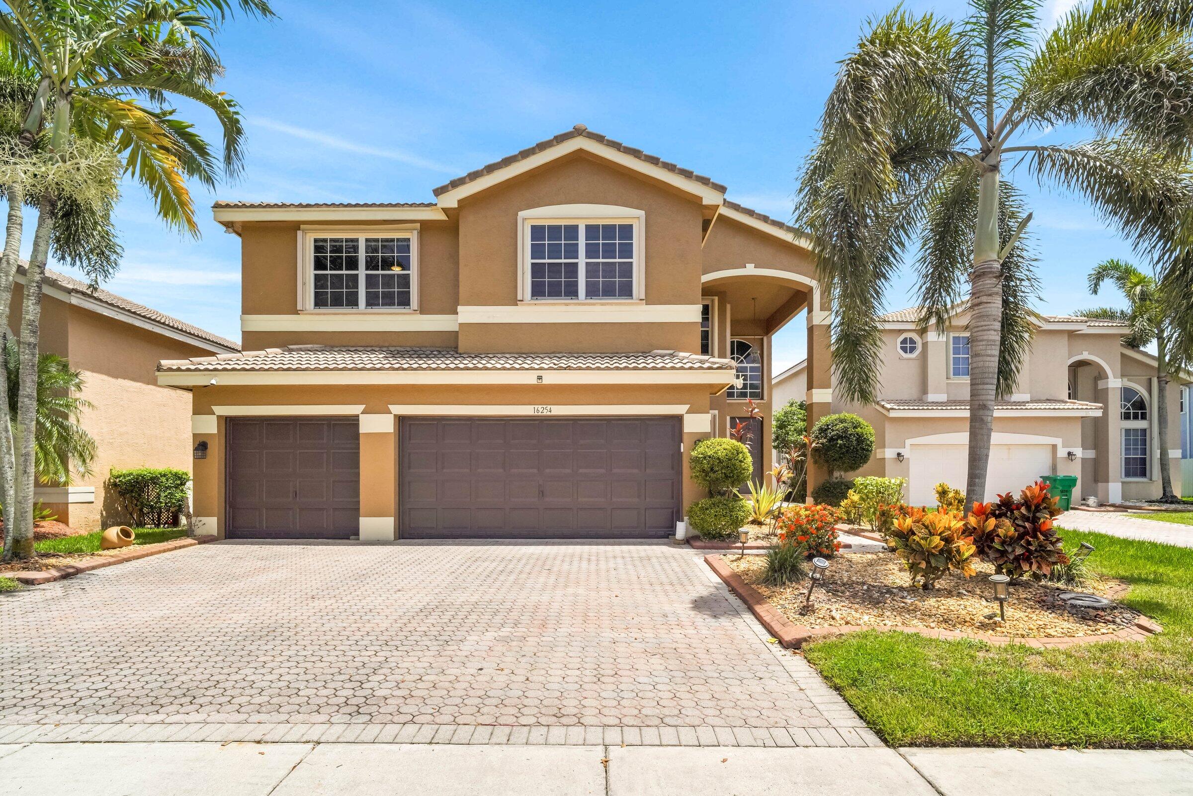 Experience refined living in Silver Shores, one of Miramar's premier privacy-attended gated communities. This beautifully maintained 5-bedroom, 3-bath home offers over 3,400 square feet of thoughtfully designed living space with soaring ceilings, abundant natural light, and an open, inviting floor plan.  The updated kitchen features quartz countertops, stainless steel appliances, contemporary cabinetry, and a spacious center island overlooking the family room. A first-floor bedroom and full bath provide ideal flexibility for guests, extended family, or a home office.  Enjoy your private backyard retreat with a sparkling saltwater pool and covered patio, perfect for relaxing or entertaining year-round. Complete with a three-car garage and conveniently located near top-rated schools.