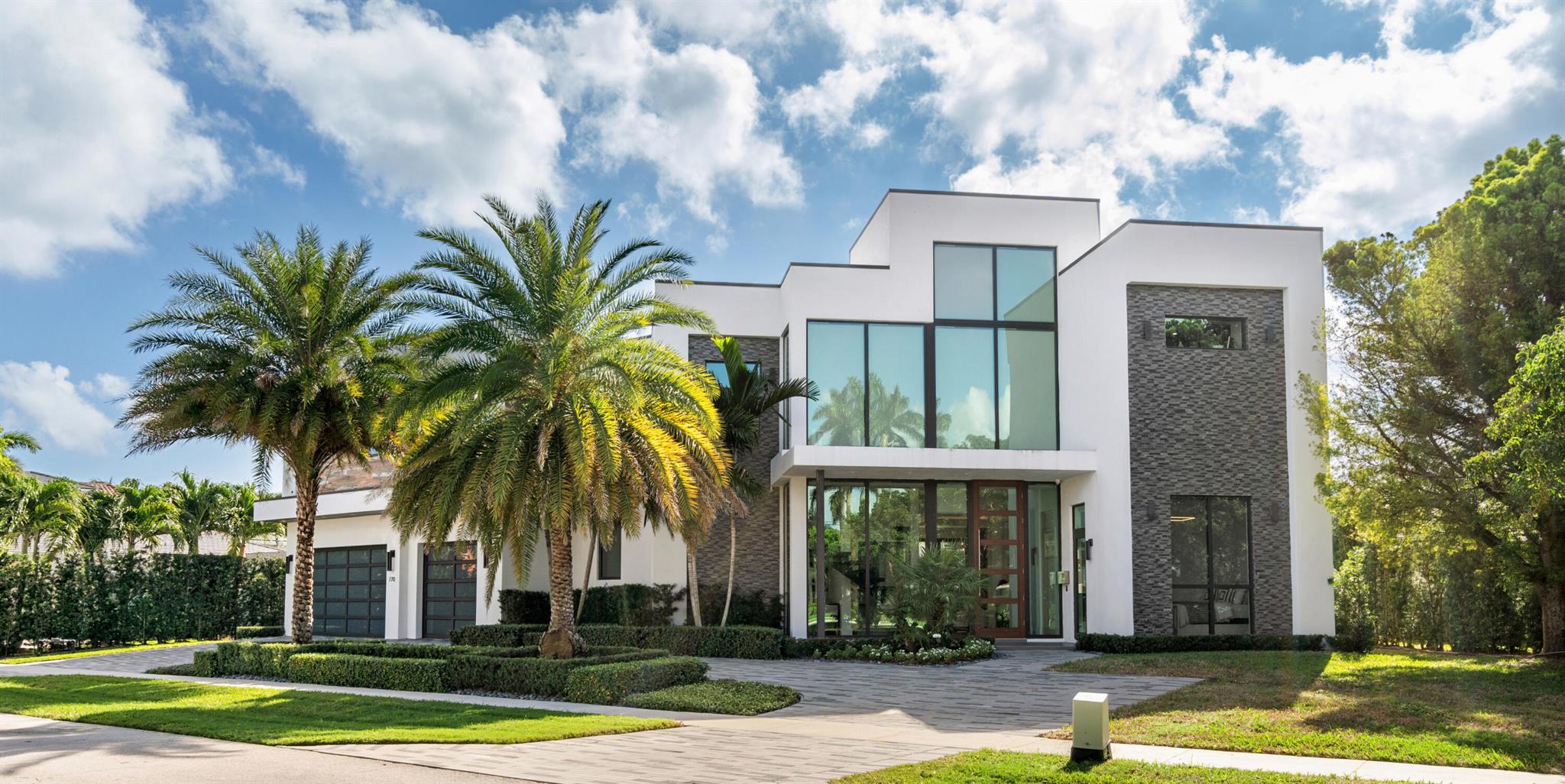 Epitomizing modern elegance, this stunning, five-bedroom masterpiece, built in 2019, meticulously maintained, and boasting 7,868 +/- total square feet, offers the ultimate in luxury coastal living. Making a breathtaking first impression immediately upon entry, the dramatic two-story foyer, with a freeform stairway and glass-encased elevator, introduces the open-concept-design living areas where window-walls of sliding glass doors open to loggias overlooking views of the resort-style backyard and scenic waterway. The living and dining rooms integrate seamlessly with the gourmet dual-island kitchen, a culinary haven fitted with contemporary, grey-lacquered cabinetry; Thermador stainless appliances; marble counters and backsplashes; and large walk-in pantry. Ideal for both relaxation and entertaining, the living room is enhanced by a sleek linear fireplace and built-in cabinetry with a beverage/wine cooler. Featuring a six-display TV system controlled by Control4 and a fully-equipped bar with seating, the impressive club room, topped by a wood-beamed ceiling, is adorned with high-quality sound-proof paneling and elegant millwork, and a half-bath/cabana bath. Also on the first floor are a guest bedroom suite and attached three-bay garage. Upstairs, the loft area serves three ensuite guest bedrooms as well as the primary suite.  A luxurious sanctuary complete with warm hardwood floors is on the second floor, the primary bedroom opens to a private balcony, and the suite comprises two oversized closets and two spa-inspired bathrooms, fitted with a freestanding tub and a single, oversized shower accessible from both bathrooms. There is another laundry for convenience. In one of Boca Raton's most premier locations, this stunning water-view estate delivers unparalleled quality at every turn.

DISCLAIMER: Information published or otherwise provided by the listing company and its representatives including but not limited to prices, measurements, square footages, lot sizes, calculations, statistics, and videos are deemed reliable but are not guaranteed and are subject to errors, omissions or changes without notice. All such information should be independently verified by any prospective purchaser or seller. Parties should perform their own due diligence to verify such information prior to a sale or listing. Listing company expressly disclaims any warranty or representation regarding such information. Prices published are either list price, sold price, and/or last asking price. The listing company participates in the Multiple Listing Service and IDX. The properties published as listed and sold are not necessarily exclusive to listing company and may be listed or have sold with other members of the Multiple Listing Service. Transactions where listing company represented both buyers and sellers are calculated as two sales. Some affiliations may not be applicable to certain geographic areas. If your property is currently listed with another broker, please disregard any solicitation for services. Information published or otherwise provided by seller, listing company or its representatives is deemed reliable but are not guaranteed and subject to errors, omissions, or changes without notice. Copyright 2025 by the listing company. All Rights Reserved.