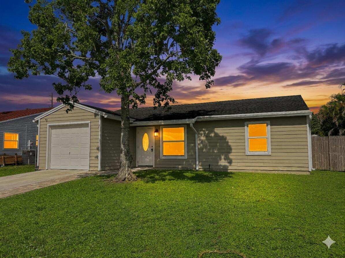 Welcome to this beautifully redone 2 bed 2 bath home with an oversized lot and a 1 car garage. This home is move in ready. Interior features newer floors, newer kitchen, newer bathrooms and new hurricane impact windows. Exterior features an oversized fenced in lot with a large patio and plenty of room for a pool. Located in a desirable neighborhood, with A rated schools. Close to shopping dining, the turnpike and I95 and much much more. Call for showing now!