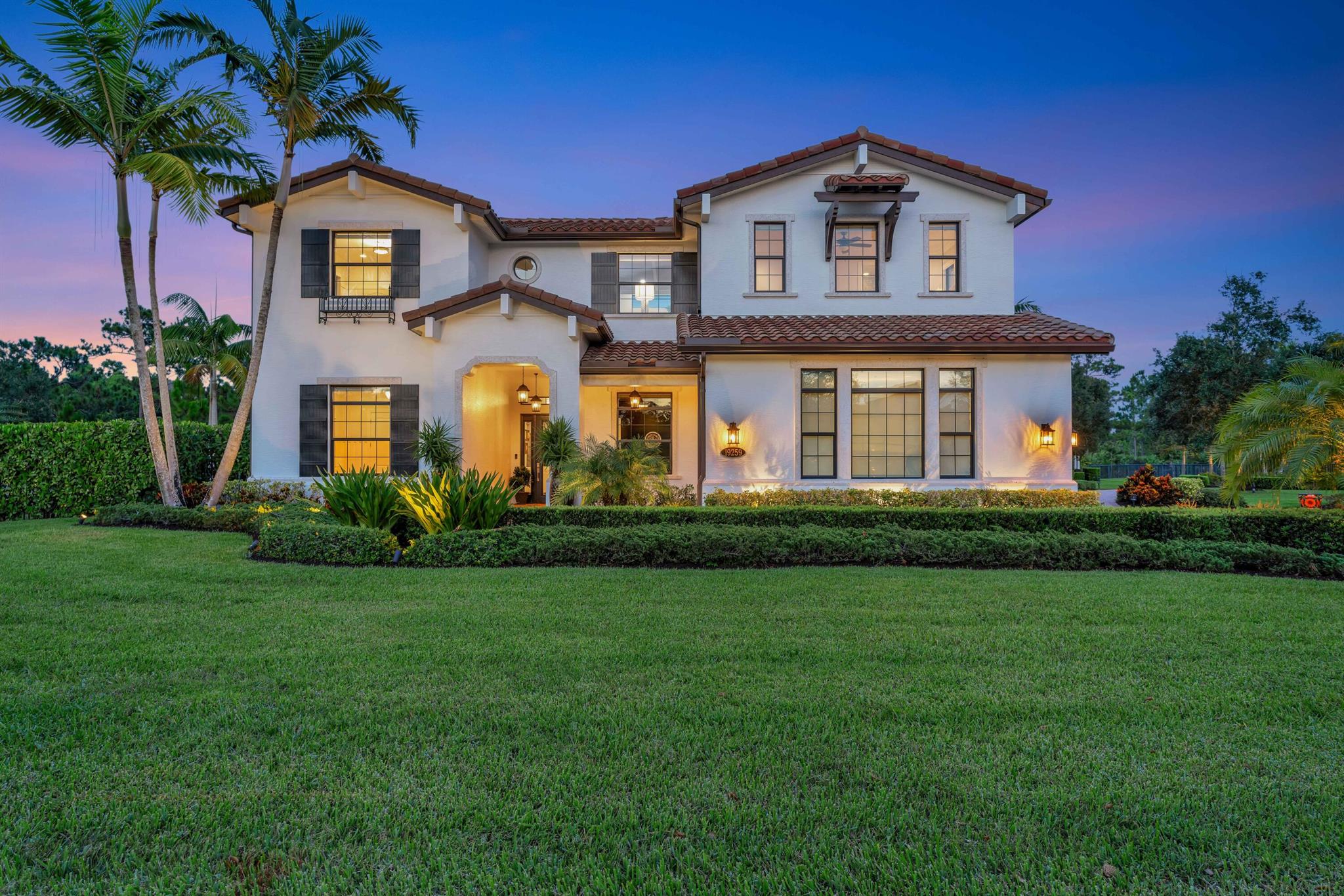 Introducing a once-in-a-lifetime opportunity! Step into the lap of luxury with this exquisite Mediterranean-style masterpiece nestled in the prestigious Prado community of Jupiter. Experience the ultimate in convenience with easy access to beaches, golf courses, shopping, and major highways like I-95 and the Florida Turnpike.

Situated on a sprawling 1.1 acre lot, this home offers unparalleled privacy thanks to its prime location next to the tranquil Pennock Preserve. Surrounded by lush, tropical landscaping, you'll feel like you've stepped into your own private paradise. The stunning award-winning LED-lit pool serves as the centerpiece of the outdoor oasis, featuring multiple levels, a lap lane, fountains, overflowing urns, and a luxurious hot tub. Relax and entertain in style on the travertine paver patio, complete with a cozy firepit, comfortable lounge furniture, and a brand-new outdoor kitchen & bar. Perfect for hosting gatherings with loved ones, this is truly your "forever home." Adjacent to the pool, you'll find a charming octagonal smokehouse gazebo, adding a touch of elegance to your outdoor living space.

The side yard is oriented around a "signature" Sylvester palm which is centered behind a brand new Har-tru bocce ball court and fronts a grove of tropical fruit trees.
 
When you step inside this impressive 5-bedroom, 5-1/2 bath home with a dedicated office, gourmet kitchen, bar & den, billiard room, and screened porch you will immediately recognize the deep attention to detail throughout, with extensive millwork, high end appliances, top-of-the-line plumbing fixtures, a custom-built temperature & humidity-controlled wine wall, coffered ceilings, and gleaming hardwood.  The massive first-floor primary bedroom features his & her vanities and walk-in closets, a cavernous shower with an overhead rainwater showerhead system, and a luxurious soaking tub. Your continuous comfort is assured with a full-house Generac generator powered by an in-ground 500-gallon propane tank.

Don't miss out on this unique opportunity to own a piece of paradise. Make this dream home yours!