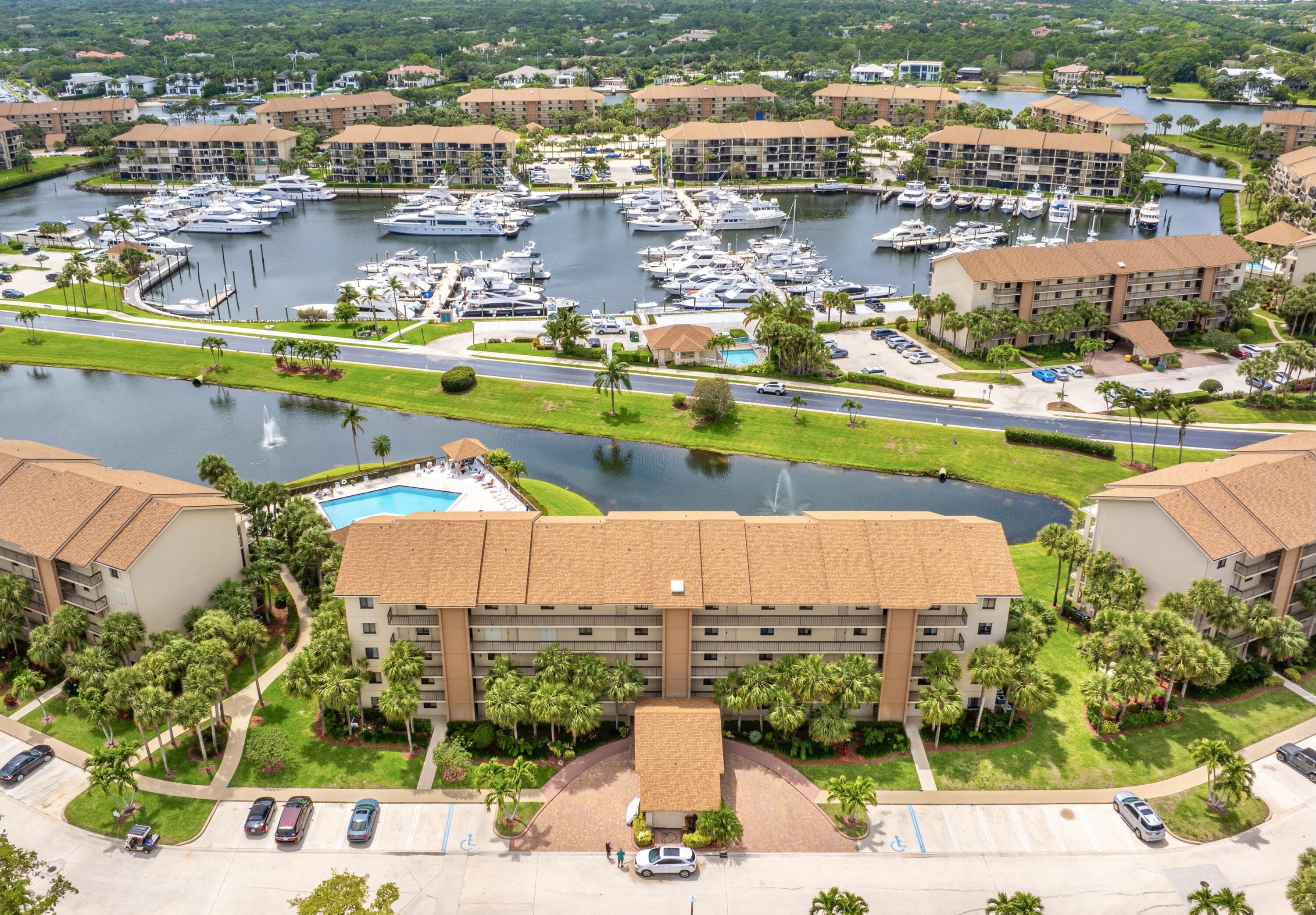 Beautiful 2 Bedroom, 2 Bath with bonus space. This light & Bright condo offers a large Great Room with impact sliders that lead to a peaceful lakefront/ Marina setting. Updated Kitchen with Newer stainless appliances. Convenient 1st floor living. Drive right up to your front door to bring your grocery and shopping items. Quick access from your patio to the pool. The Bluffs Marina amenities include 4 pools, tennis & pickle ball courts and a quick walk or bike to the beach. Close to all the casual & fine restaurants, numerous Golf Courses, shopping at Bluffs Publix Plaza, Gardens Mall & Harbourside Shoppes. 20 Minutes to Palm Beach International Airport. Terrific Condo, Perfect location