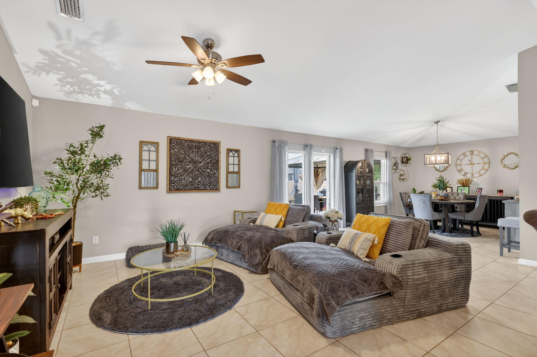 We've got a great one for you today!  Built in 2022, this Synergy Homes Biltmore Model is waiting for its next owners to make new memories.  If you're looking for an opportunity for a vacation home or AirBNB rental, the Owners are willing to negotiate a price to sell fully turnkey furnished!  Literally just bring your toothbrush!  This home shows true pride of ownership. When asked what they'd miss the most, the Owner's response was "the warm feeling, super safe neighborhood, and most of all the neighbors."  As you step into the welcoming Foyer entry, you'll immediately feel at home.   The kitchen is in the heart of the home with recent upgrades such as a larger fridge, over-island lighting, Farmer's sink, new faucet, and disposal.  Pantry with a built-in door-mounted spice rack.  Center island with breakfast bar for informal dining.   Open floor plan with split bedrooms (primary on one side and 3 bedrooms with guest bath on the other).  The owner designed one of the bedrooms as an amazing dressing room and closet.  Wait till you see it!  You'll notice this is not a standard builder-grade home.  Recent upgrades include custom decorative mailbox, handmade wooden decorative shutters on the exterior, updated plumbing and lighting fixtures, shower doors, and hidden wiring for your wall-mounted TV's.  A sliding barn door was added to give the primary suite more privacy.  Impact glass front door was added to provide more natural light.  In the backyard, you will find a wooden privacy fence, a poured concrete deck measuring 20' x 45' (WOW) with a hot tub, two metal-roof gazebos for shade and a wooden pergola over the spa.  Storage shed will remain for your convenience, as well.  The owned Vivant Security System is equipped with 24-hour surveillance with front and rear cameras, as well as a doorbell camera, flood alarm, glass-break alarms on windows, and an emergency necklace.   The Sellers are able to convey the home unfurnished, but would LOVE if someone was interested in buying it "turnkey furnished" with all furniture, fixtures, decor, linens, cookware...the whole kit-n-kaboodle!  Want all of the furniture in addition to this amazing home?  Make us an offer they can't refuse!  Don't wait!  Call and book your private showing today!  Photos don't do it justice...you have to see this place to appreciate the pride of ownership.