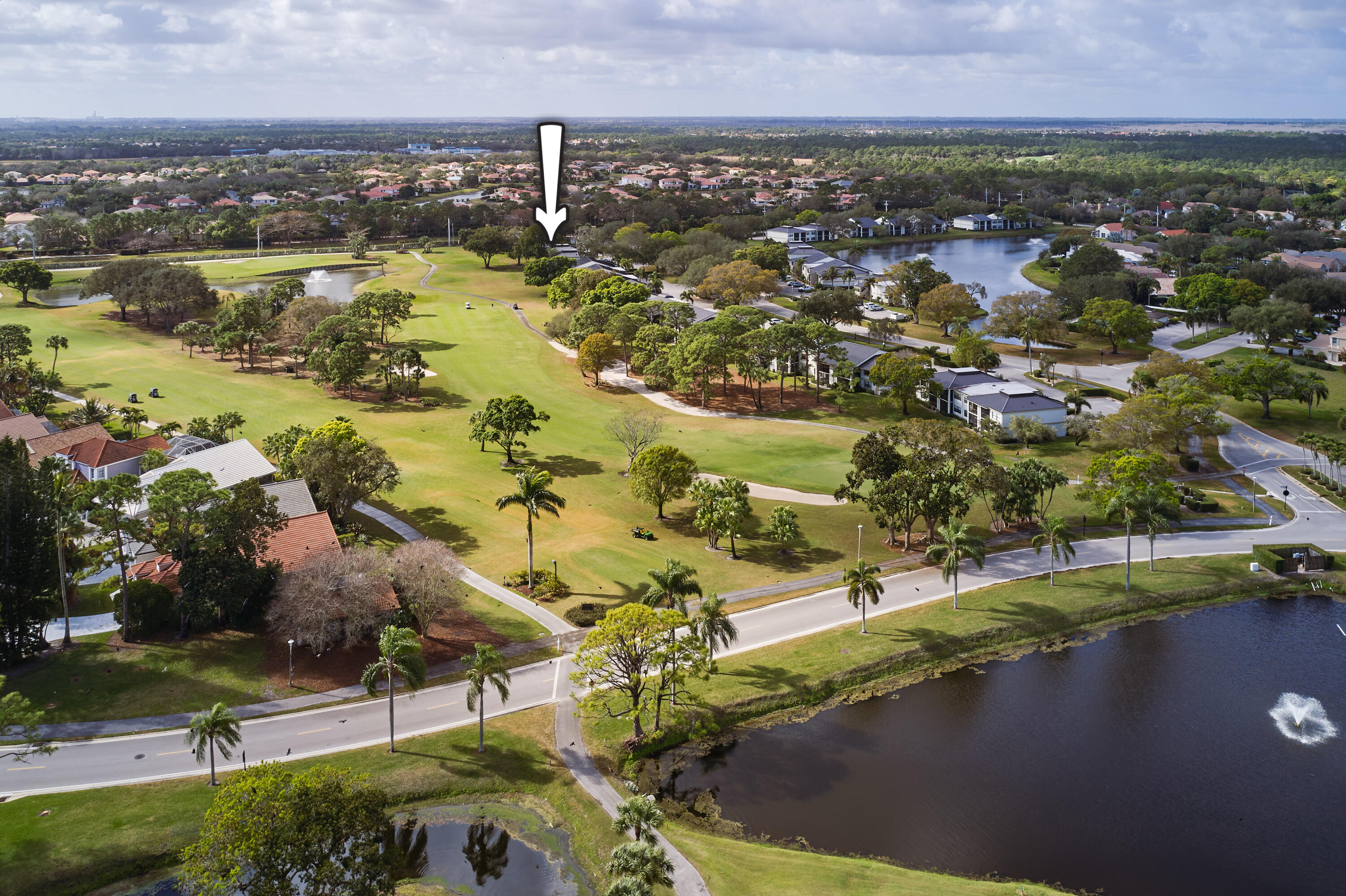 Stunning golf & lake views over Hole 4 of the West Course set the stage for this appealing and private second-floor condo in Eastpointe. This 2BR/2BA home offers one-level living with peaceful water and fairway vistas from the main living areas and terrace. The open-concept living and dining spaces feature luxury vinyl flooring and flow seamlessly together, creating a bright and inviting atmosphere. Sliders and large windows frame the panoramic view, bringing natural light indoors and enhancing the tranquil setting. The kitchen has been semi-updated with rich cherry wood cabinetry, granite countertops, and white appliances, offering a warm and functional space that opens to the main living area. The primary suite features Pergo-style flooring, a large double window, sliders to the terrace, and an updated en-suite bath with tub. The guest bedroom includes vinyl flooring and a double closet, providing comfortable accommodations for visitors. A 2024 roof adds peace of mind. Located in the gated community of Eastpointe Country Club, residents enjoy two championship golf courses, tennis, pickleball, pools, fitness facilities, dining, and a newly renovated clubhouse. Conveniently located close to shopping, dining, beaches, and major highways.