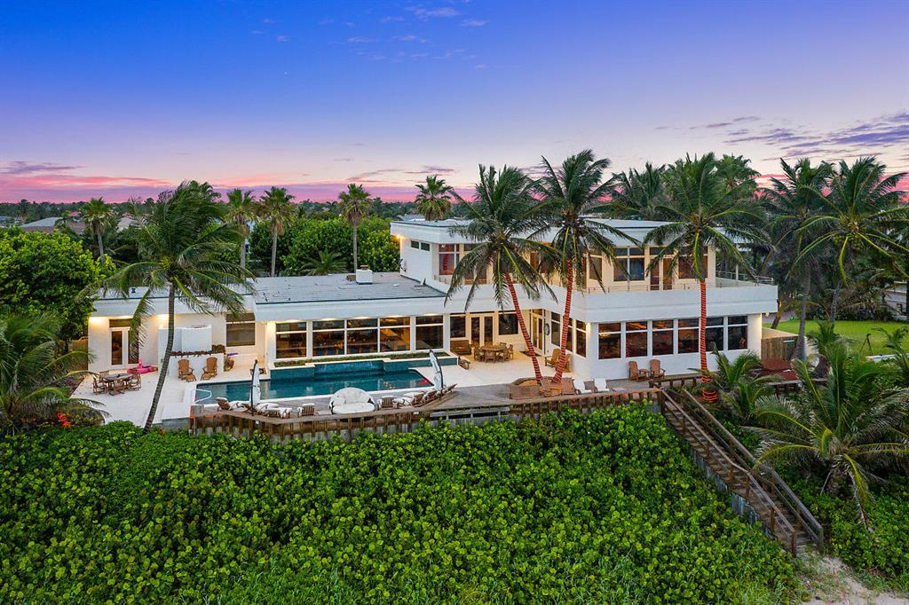 Impressively maintained 3 story ocean front estate home on the exclusive Hillsboro Mile. Featuring 153 ft of sprawling Ocean to Intercoastal views and a 153 ft deep water dock in a slow zone. This 5 bed 5.4 bath home features a third floor master suite with stunning ocean views, garage space for 9 cars and a new full house generator.