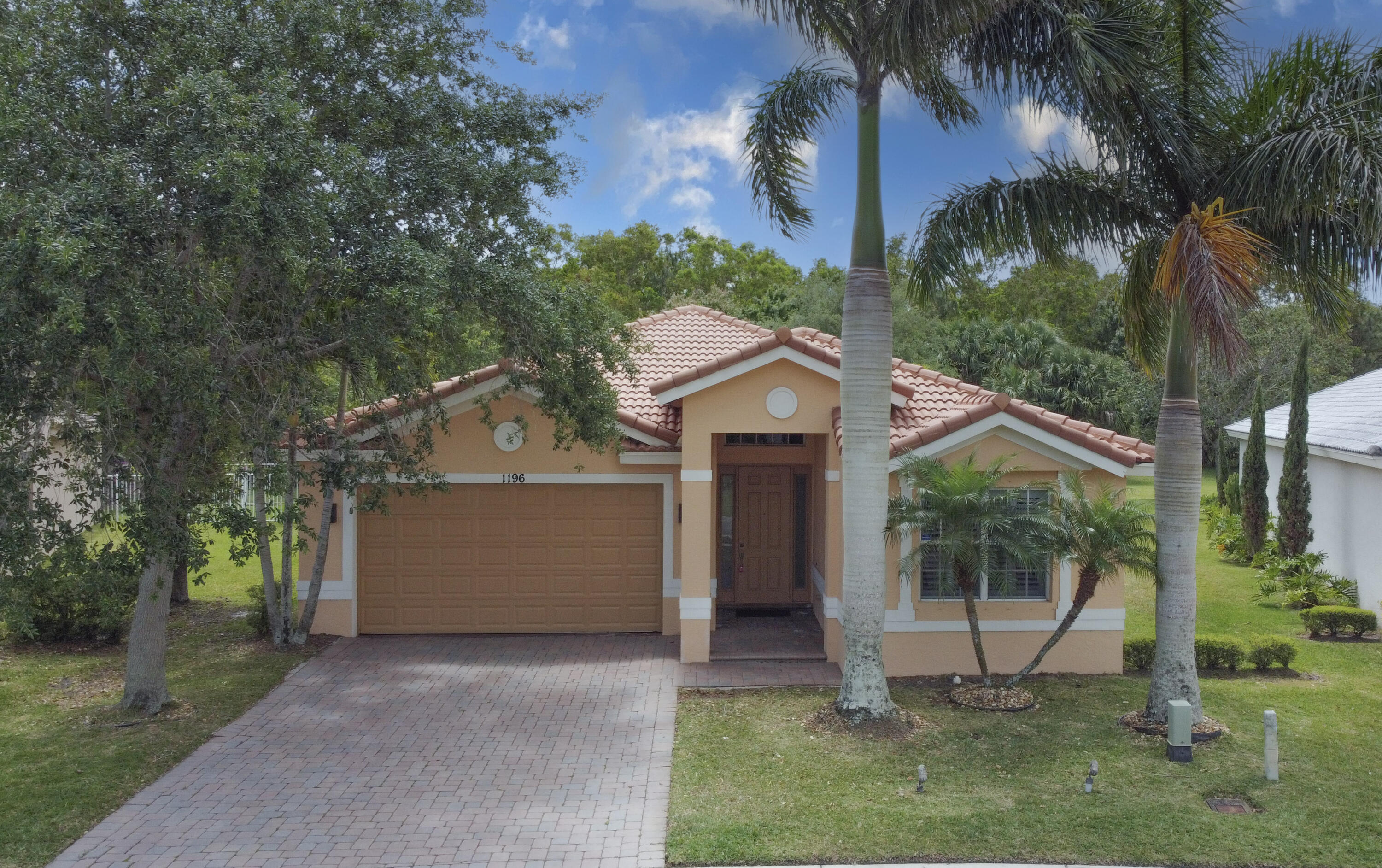 Welcome to 1196 SE Fleming Way! Located in the sought after community of Martin's Crossing, this spacious 3 bedroom, 2 bathroom single family home offers nearly 2,200 sq ft under air with a split floor plan, 2 car garage, and plantation shutters throughout. The open-concept kitchen, extra tall vaulted ceilings, and screened-in patio create a comfortable layout that works well for both entertaining and relaxing. HOA includes a clubhouse, pool, tennis courts, fitness center, sidewalks, children's play area, lawn care, basic cable, and WiFi. Conveniently located in central Stuart near I-95, shopping, dining, top rated schools, parks, and major roadways. Pets allowed with approval. Don't miss this great opportunity to rent a well-maintained home in one of Martin County's most desirable  communities! Call for a tour today!