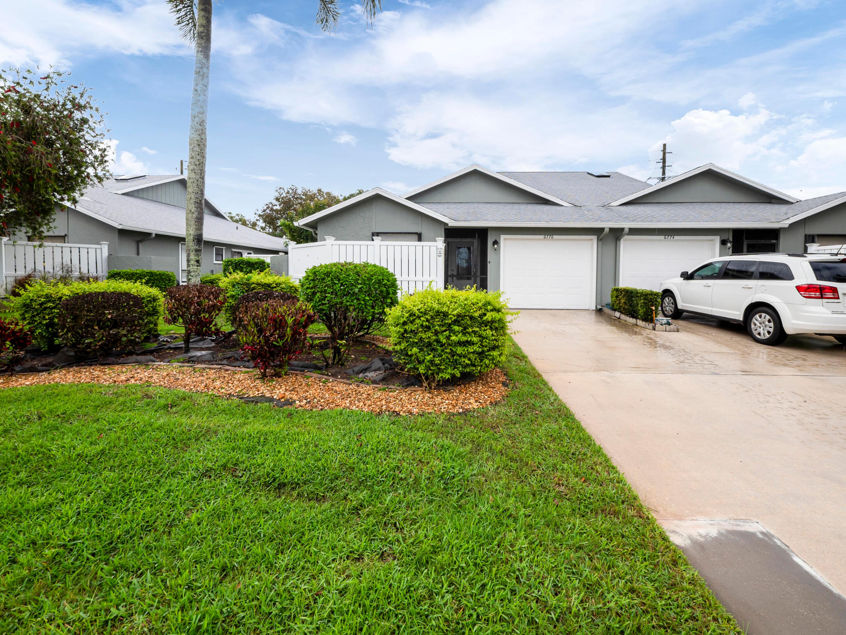Your search ends today. Rare is an understatement for a property this clean, this bright, and this perfectly positioned in the heart of Hobe Sound. From the chef-ready kitchen to the sprawling living area that begs for a dinner party, every square foot has been curated for a life of ease. This isn't just another listing—it's the Hobe Sound gem you've been waiting to hit the market. Don't be the one hearing "sorry, it's under contract" tomorrow. Open Concept: Vaulted ceilings in the main living and dining area create a massive, airy feel.  Move-In Ready Kitchen: Features warm wood cabinetry, granite countertops, and a functional U-shaped layout with a breakfast bar.  Indoor-Outdoor Flow: Large sliding glass doors lead to a screened-in patio/lanai, perfect for year-round enjoyment.  Master Suite Perks: Includes a substantial walk-in closet with built-in shelving and a clean, walk-in shower.  Curb Appeal: Tropical landscaping and a private driveway leading to a one-car garage.