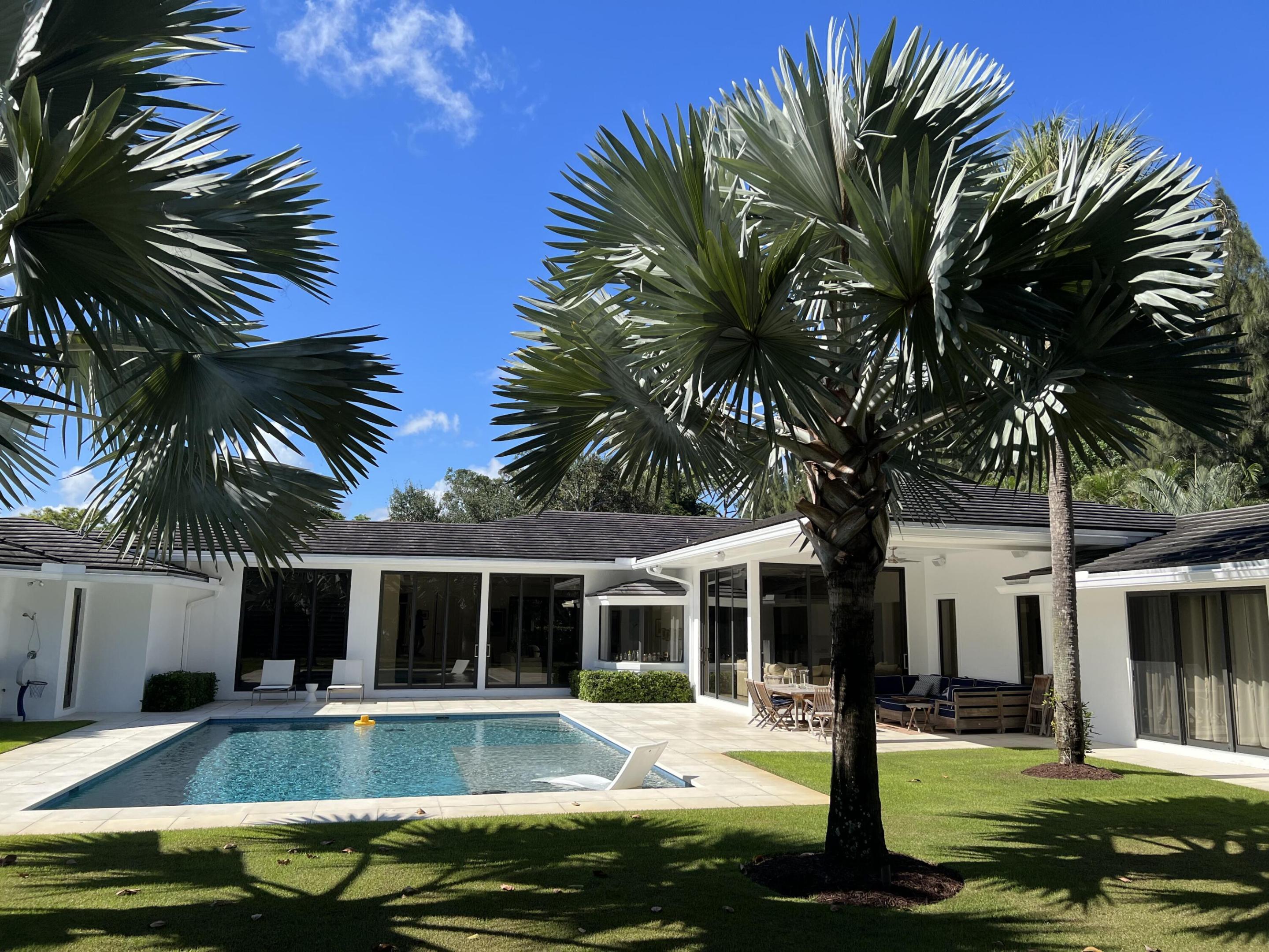 This stunning, contemporary home has been completely updated. Sitting on over an acre of manicured land inside the hidden gem of a community, Foxe Chase, this property offers endless features and upgrades. From the moment you arrive, the paved motor court is expansive and welcoming. The resort style pool with mature vegetation offers complete privacy. The covered loggias provide shelter from sun or rain. Indoor/Outdoor living with endless options for entertaining is what makes this property an entertainer's paradise. The interior is complete with Wolf and SubZero appliances in the chef's dream kitchen. The split bedrooms offer the primary suite complete privacy along with access to an outdoor shower and direct pool access. A fully fenced in  yard completes this majestic property.