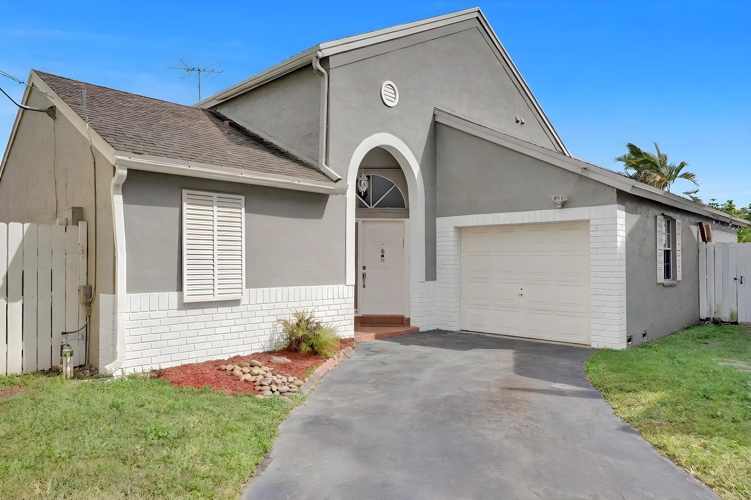 A Beautiful and spacious 3 bedrooms 2 bathrooms home in the peaceful neighborhood of Scarborough in West Davie.  The house features a large kitchen with granite counter-tops and stainless steel appliances.  Laminate floor throughout the house.  Split floor plan with vaulted ceilings.  Very spacious and very bright.  Ring doorbell and fiber optic ready.  The property has been updated with new plumbing throughout the entire home.  Corner house, fully fenced with a large screen patio perfect for entertainment.  A very well maintained community with a community pool and spa, playgrounds, tennis and basketball courts.  Centrally located, easy access to I-595 and other main highways, shopping centers, restaurants, Sawgrass Mills, places of worships and much more.  A+ school zone!!!