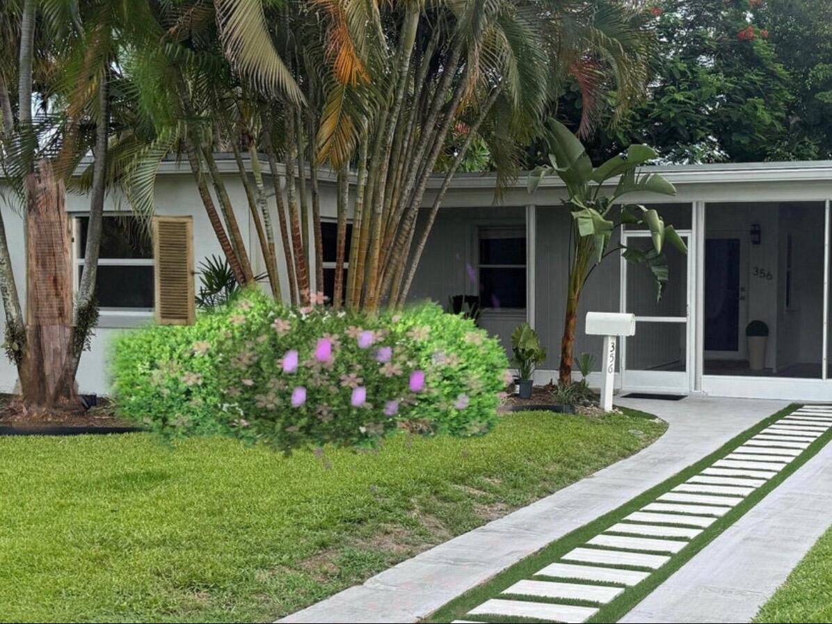 Charming, lovely renovated home in SoSo with a European-inspired feel featuring vinyl flooring, vaulted ceilings, and an oversized backyard with endless possibilities. Ideally located near trendy restaurants, Trader Joe's, the Flagler Drive waterfront bike path, Antique Row, Palm Beach Island, the South Olive Tennis Center, Phipps Park, and vibrant downtown West Palm Beach. Move-in ready with character, charm, and an unbeatable location.