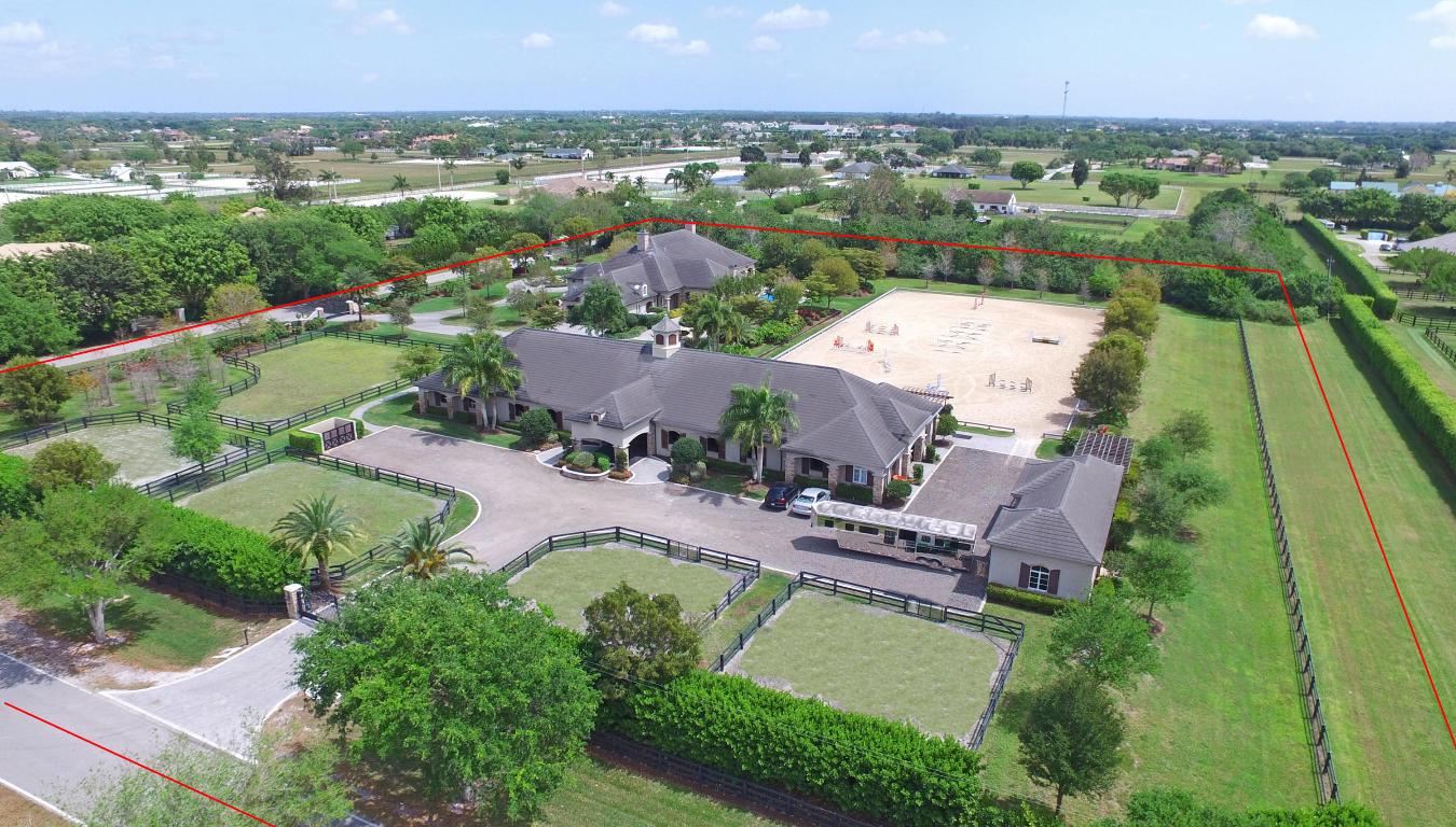 This equestrian estate sits on 5.44 masterfully landscaped acres. Built in 2011, the chateau-inspired main house boasts 4 bedrooms, 4 baths (3 en suite), a concrete tile roof, hardwood & marble floors, and coffered ceilings. The space features a custom kitchen with Viking gas stove, billiard room, sound system, and indoor/outdoor fireplaces. The master bedroom opens onto a large covered patio with a summer kitchen and infinity pool and spa.
With 5 turnout paddocks, and a 120x230 foot all-weather Riso arena, the property delivers for even the most discerning equestrians. The stable boasts 12 14’x14’ stalls and an owner’s lounge with full bath, tack room and laundry. Another building holds 3 wash stalls, 2 garage bays and tractor storage. Just minutes away from WEF show grounds!