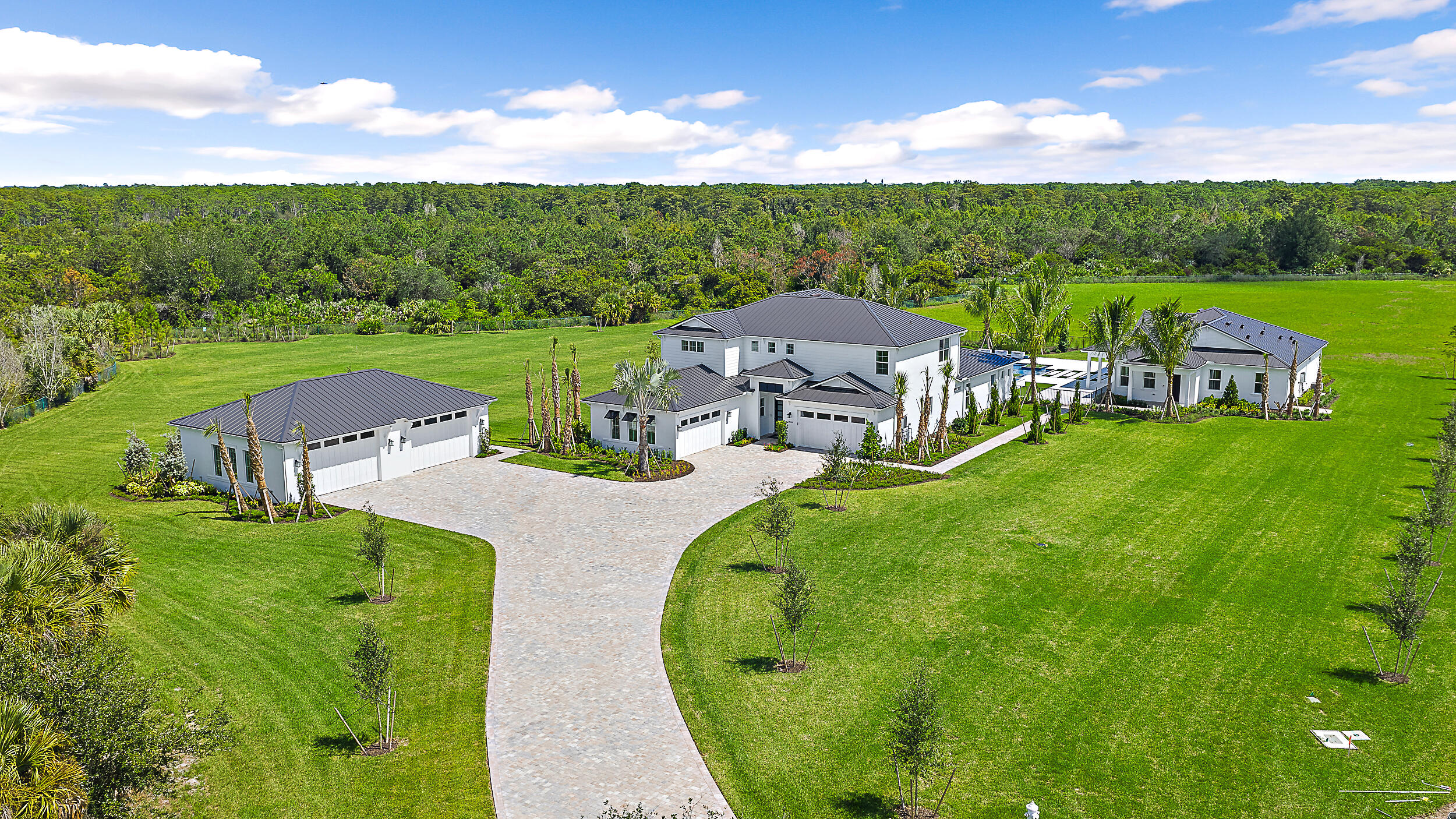 NEW CONSTRUCTION: Come live the luxury you deserve! Bridgewater's crown jewel - a 4.61-acre estate offering unmatched privacy, luxury, and lifestyle in the heart of Jupiter, east of I-95. Set on one of the largest and most private homesites in the nearly sold-out Bridgewater community, this exceptional property features brand-new construction, a separate guest house, detached garage, and a resort-style saltwater pool — all surrounded by lush landscape and endless potential. This estate delivers the ultimate blend of elegance, convenience, and natural tranquility. Design your dream outdoor oasis with ample space for a private golf hole, pickleball court, or tennis court. Elegant Design Finishes will delight you at every turn.