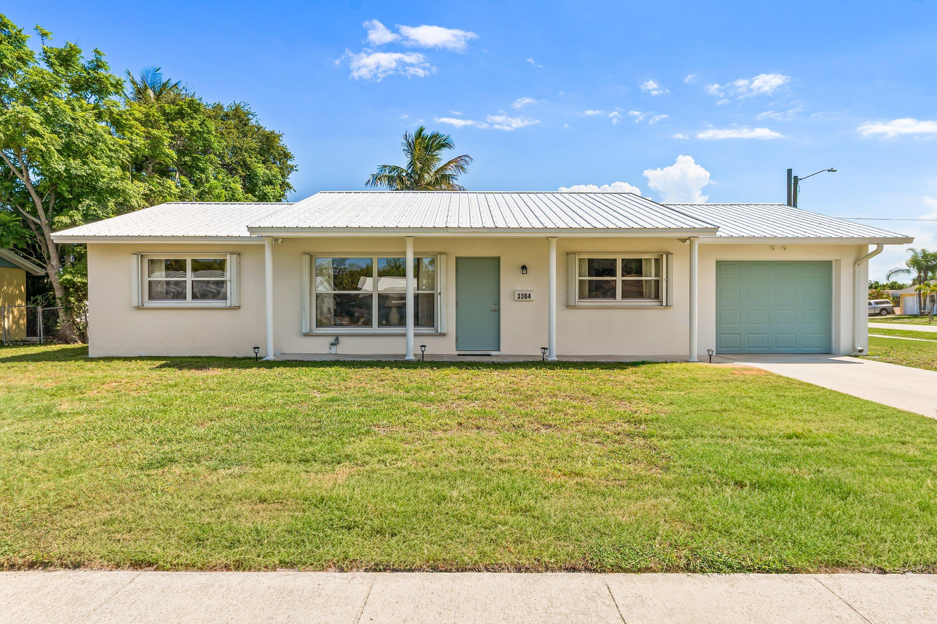 Welcome to this BRIGHT NEWLY RENOVATED 3-bedroom, 2-bath home with 1-car garage, perfectly situated on a generous CORNER LOT. Meticulously maintained by original owner and NO HOA, this property offers the perfect canvas for your personal touch. Enjoy an unbeatable quiet location just minutes from I-95, the turnpike, the Gardens Mall, top-rated schools, and beaches.  Whether you're a first-time buyer or looking to customize your forever home, this is a rare opportunity in one of Palm Beach Gardens' desirable areas! Backyard has plenty of room for POOL! Replacements: A/C 2018, Metal Roof 2010, Washer/Dryer 2023, Windows 2010, Hot Water Heater 2014, Reinforced Garage Door 2010, Dishwasher/Microwave 2026, Stove/Oven/Refrigerator 2018.