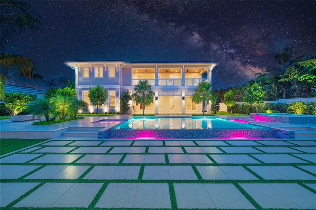 New Construction British West Indies estate boasting 100+/- feet of water frontage on the Intercoastal waterway in the enclave of Lauderdale By The Sea. Walk to the beach or local restaurants. Double door entry expands to glassed encased rooms that view the Intercoastal & pool. Smart home automation throughout. Classically-Chic Chef's Kitchen, with sub-zero & wolf appliances, including a gas range with natural gas hookup. Luxurious master quarters feature spa-like baths, his/hers wardrobes, his/hers water closets, with a makeup vanity & private waterfront balcony. Luxuriate in outdoor entertaining at the resort-style pool with a covered lanai, an outdoor summer kitchen, fire-pit, and a cabana bath with an outdoor shower. Composite made yacht dock with cleats, bumpers, 60 Amp pedestal.