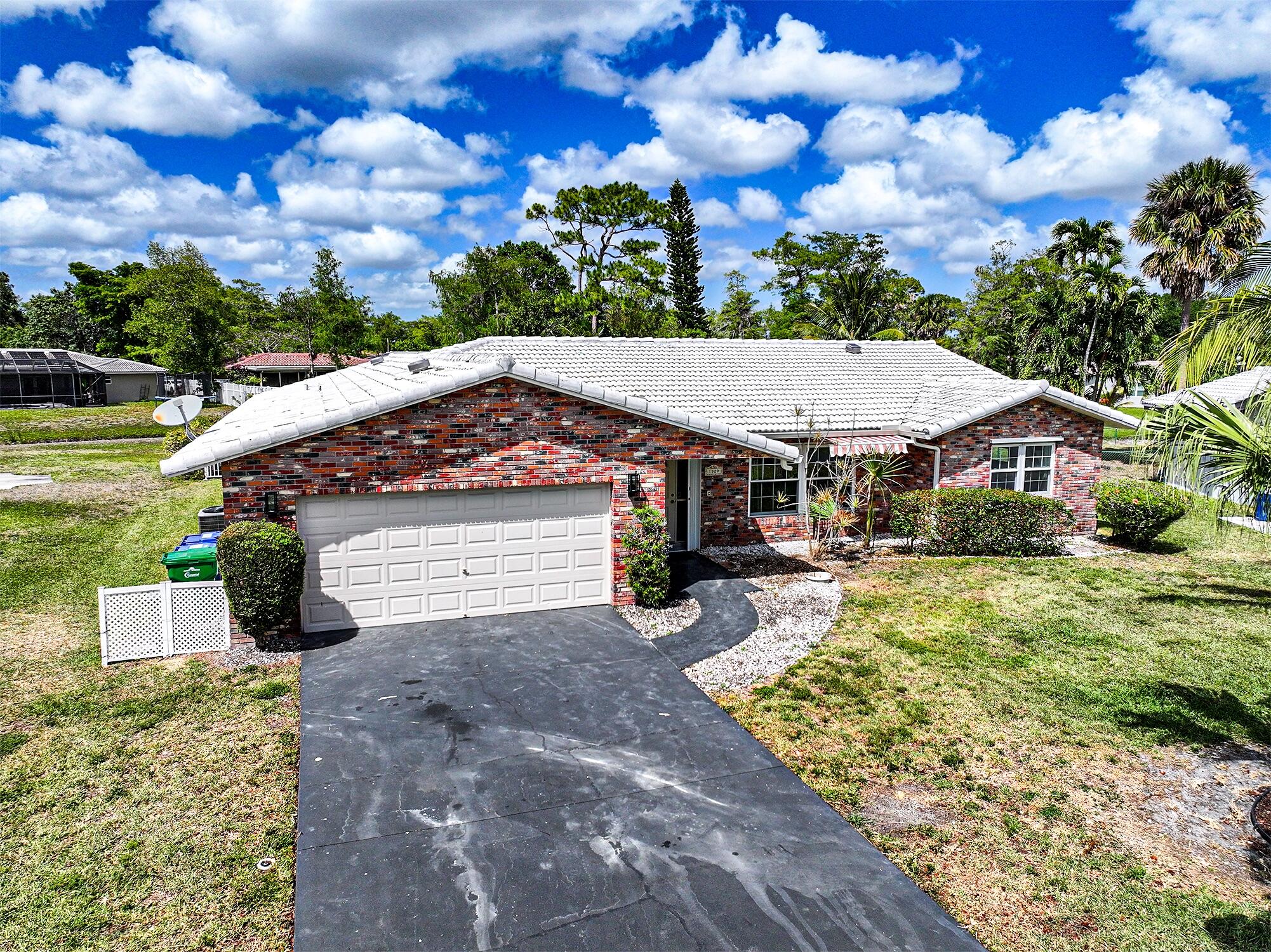 Landlord is Highly Motivated, Bring All Offers! ''Airbnb'' & ''VRBO'' Short Term leasing availability. New home set on a large, private, fenced waterfront lot - offering both tranquility and security. There is a barrier fence around the pool for added safety. Inside, you'll find beautiful laminate floors throughout the 4 bedrooms, living room, and great room, providing a warm, cohesive look. The ceramic tile in the kitchen, dining room, master bedroom, and breakfast area adds a touch of elegance and is easy to maintain. This home boasts two cabana baths, ideal for hosting guests or enjoying a relaxing retreat. Impact glass windows and sliders provide both protection and natural light, ensuring your home stays secure and bright year-round!