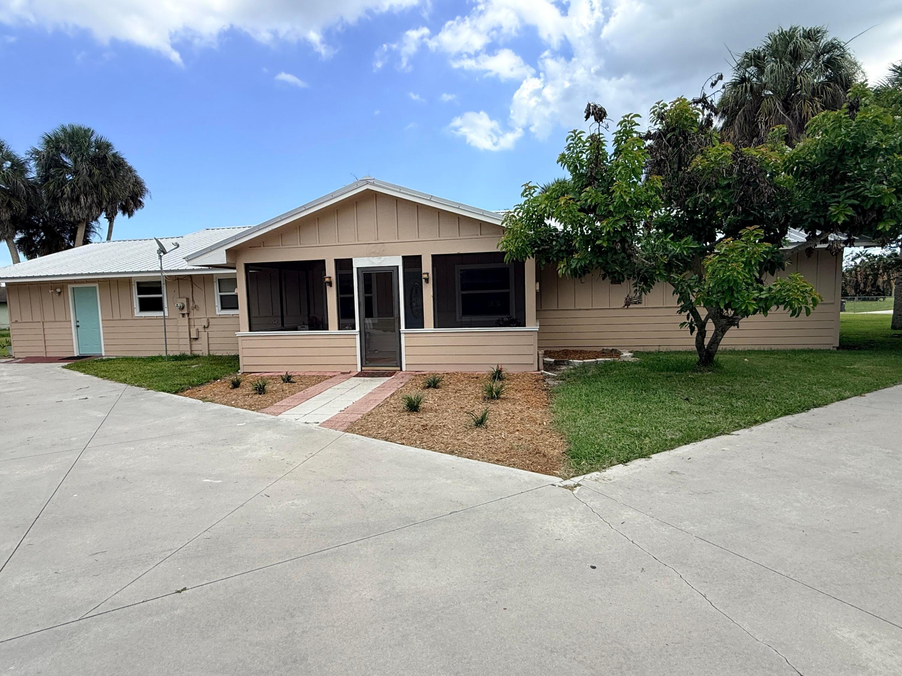 Welcome to the sought-after fly-in community of River Oak Acres! This 3BR/2BA home offers 2,484 total square feet and sits on 1.3 acres with direct runway frontage, making it ideal for aviation enthusiasts. The impressive 2,400+ sq. ft. aircraft hangar provides ample space for your plane, workshop, RV, or additional storage, while the 2,300 sq. ft. concrete parking area offers plenty of room for guests and equipment. Located just across the street from the scenic Kissimmee River and only minutes from world-renowned Lake Okeechobee, you'll enjoy the perfect blend of aviation and outdoor recreation with exceptional fishing, boating, and nature right at your doorstep. Live where you can fly home, fish all day, and enjoy the best of Florida living.