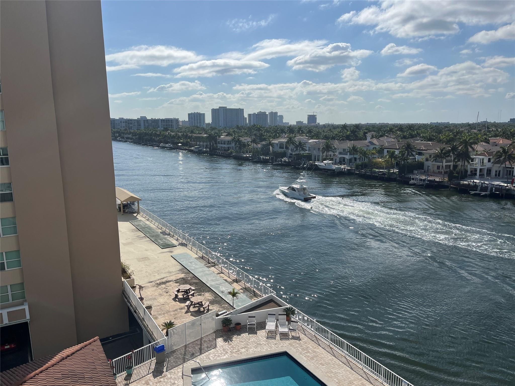 Lovely 1 Bedrm/1.5 Bath condo on the Intracoastal Waterway of Hollywood Beach with wonderful waterviews of the Waterway and Ocean from the private balcony. Enjoy the spectacular Sunsets and Sunrises from your southside balcony & the easy access to the vibrant world famous Hollywood Beach Broadwalk with fabulous restaurants, shops & entertainment! Open floor plan features new impact windows and doors! *Convenient undercover parking space*. The building is in compliance with the safety inspection requirements with great upgrade components taking the building to a higher level adding confidence and value to your investment!  The seawall is the best on the beach! Lots of guest parking! A gem located between Hollywood Blvd & Hallandale Beach Blvd AKA: The Million Dollar Corridor!