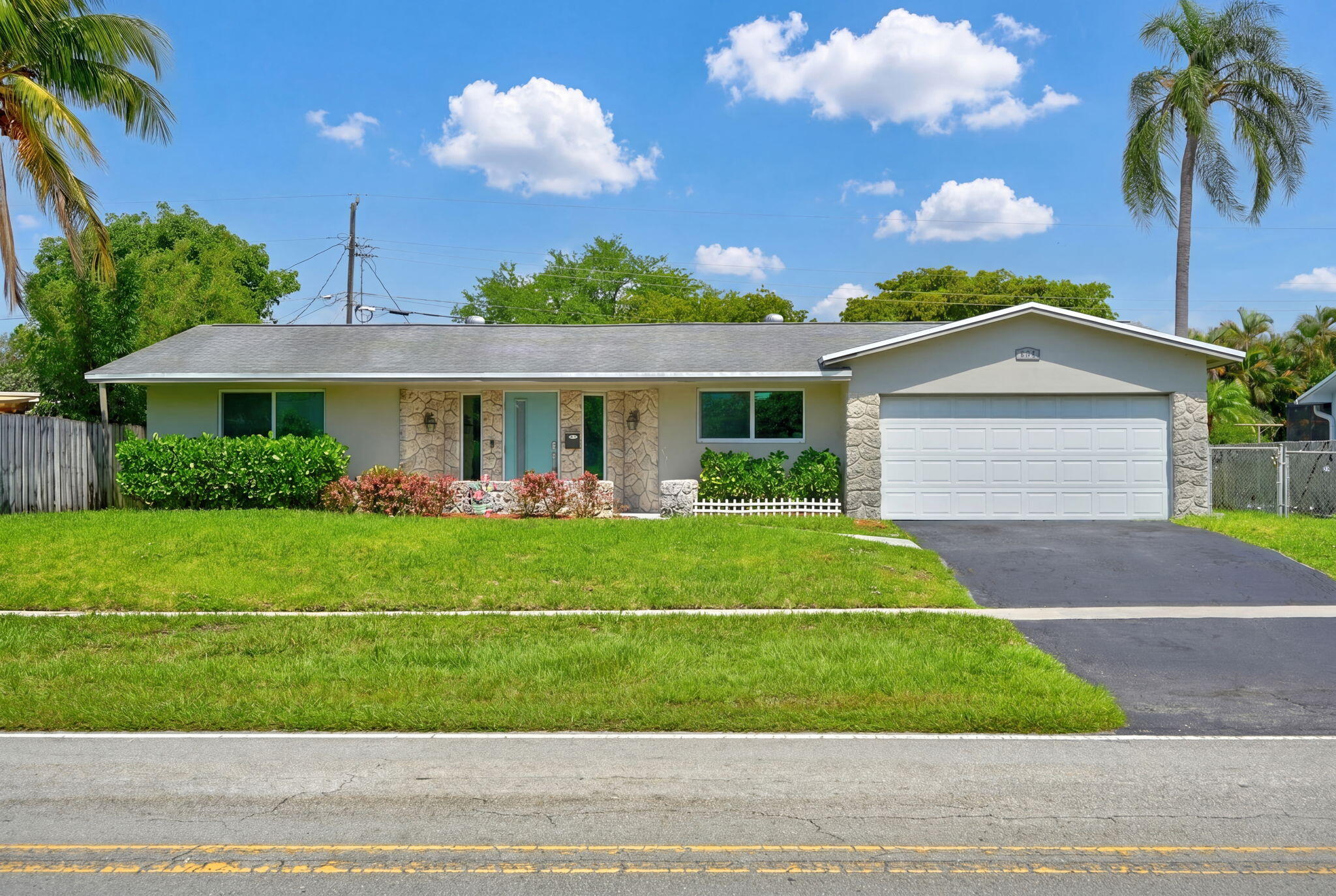Welcome to this beautifully updated 5-bedroom, 2-bathroom home in the heart of Coconut Creek! Offering over 2,451 square feet of living space, this spacious residence combines comfort, functionality, and peace of mind with numerous major improvements already completed.  The home features a fully updated kitchen and main bathroom (2018), along with all plumbing replaced in 2018 and a new roof installed the same year. Hurricane-impact windows and doors were added in 2020, providing enhanced storm protection and energy efficiency. Dual air conditioning systems (5-ton and 2-ton units) were replaced in 2021, and the property underwent professional termite fumigation in 2023.  Inside, you'll find generous living and dining areas, a large family room, and plenty of space for entertaining or accommodating a growing family. The fenced backyard offers privacy and room to enjoy Florida living year-round.  Best of all, there is NO HOA, giving you the freedom to enjoy your property without additional restrictions or fees.  Ideally located within walking distance to three parks and close to Coconut Creek schools, this home offers convenience, recreation, and an exceptional neighborhood setting. With major updates already completed, this move-in-ready property is a rare opportunity in one of Coconut Creek's most desirable locations.