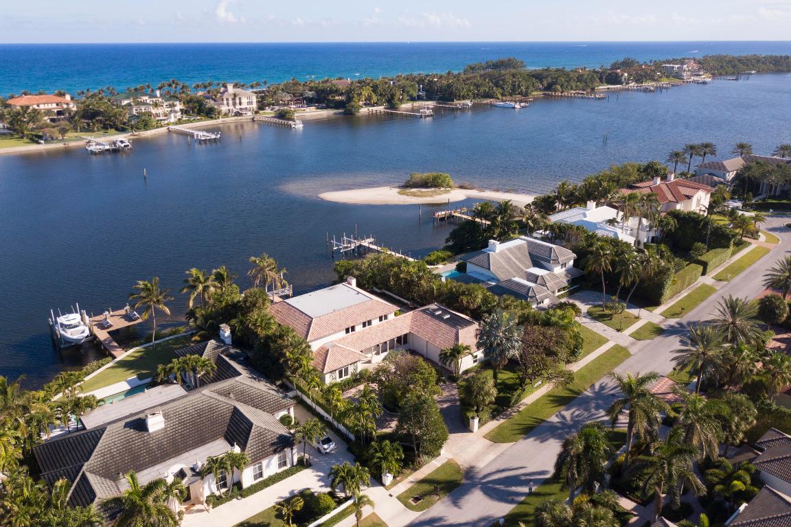 Mediterranean 3 Bed/3 Bath Pt. Manalapan Villa with panoramic views of the Intracoastal 100+ frontage. Completely renovated, this home has a separate 4-car garage with a 1/1 apartment, a heated lap pool & spa, dining room overlooking the pool. Massive primary suite on the second floor. Dual vanities, rain shower, sitting room and expansive walk-in closet with private laundry all overlooking the ocean and Intracoastal. Also on the second floor, a 1/1 guest room and another 1/1 on first floor. Prv dock with lift in no-wake zone. Residents enjoy a gratis membership to The LaCoquille Club at the famous Eau Palm Beach Hotel & Spa featuring Nobu. Exclusive access to a renowned spa, fitness center, golf & tennis, pool & beach facilities. Located between PB & Delray Beach.