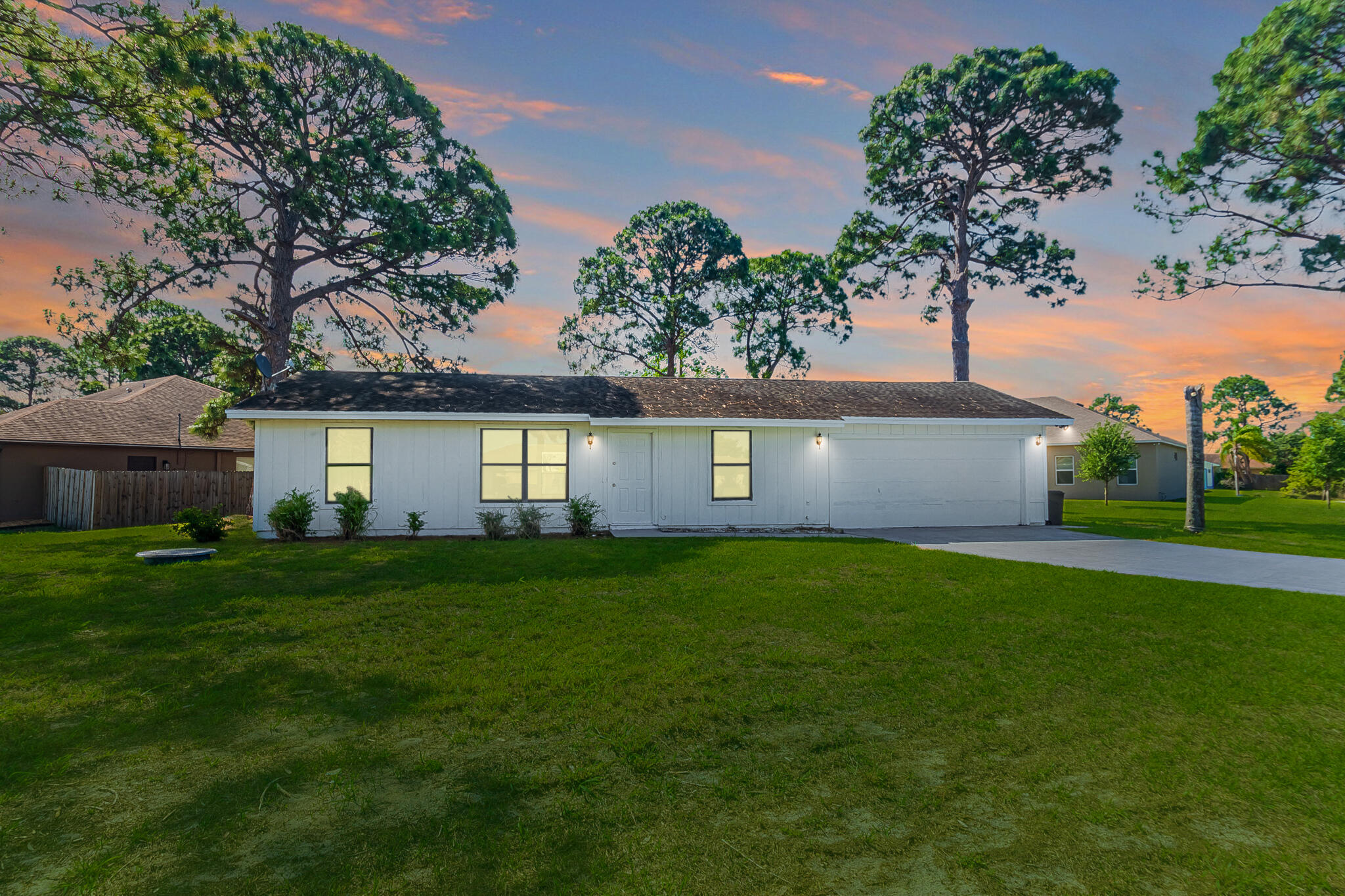 Freshly updated and move-in ready, this 2BR + flex space, 2BA corner-lot home blends comfort, versatility, and convenience. Bright, open living with tile flooring throughout and fresh interior/exterior paint creates a clean, modern feel. The versatile flex area is ideal for a home office, den, or guest space. Enjoy a covered, screened-in porch—perfect for relaxing or entertaining year-round. Added value with a newer 2023 water heater and an oversized 2-car garage with washer/dryer. Centrally located near shopping, dining, entertainment, medical facilities, and easy highway access. Schedule your showing today! GC 4 POINT INSPECTION REPORT CONFIRMS 4 YEARS REMAINING LIFE - AFFORDABLE HOMEOWNER INSURANCE AVAILABLE.