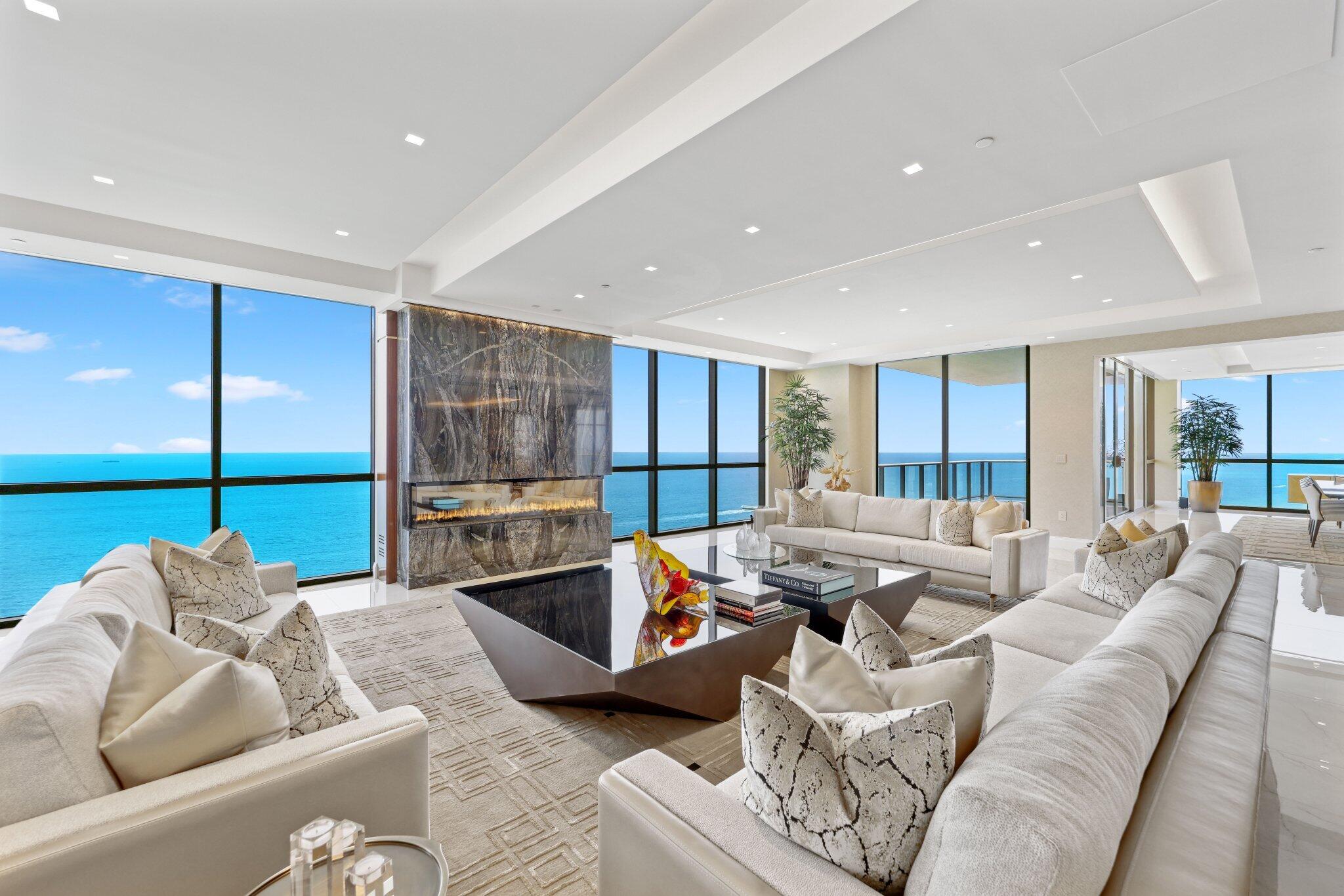 Commanding the Entire Floor, Tower Suite 39 is a True Legacy Offering for those who Demand the Extraordinary. Curated for the Global Elite, this Oceanfront Residence Seamlessly Blends Privacy and Exceptional Craftsmanship—featuring Museum-Quality Stonework, Bespoke Millwork and Spatial Design that Defines Ultra-Luxury. Spanning Over 10,000 Square Feet of Interior Space and Framed by Sweeping 270-Degree Views of the Atlantic Ocean, Intracoastal Waterway, and City Skyline, Signature Details include Illuminated Baobab Stone With Labradorite Shimmer, a Dramatic 600-Gallon Saltwater Aquarium, a Chic Private Club Lounge Clad in Taj Mahal Stone, a Kitchen Tailored for the Epicurean Connoisseur, an Outdoor Grill, Smart Whole-Home Automation, and a Private Enclosed Two-Car Garage w/ Extra Storage. An Unparalleled Array Of Bespoke Upgrades Elevate This Residence Beyond Compare. The Downsview-Designed Kitchen Showcases a Custom La Cornue Range and Hood, Belvedere Quartzite Countertops, Waterstone Wheel Faucet, and Concealed Australian Point Pods Power Sockets With Stone InlaysFlanked By Sub-Zero Refrigeration, Miele and Fisher & Paykel Dishwashers, and a Marvel Ice Maker. The Dining Bar Is a Showpiece, Featuring Rare Backlit Baobab Granite and Four Sub-Zero Wine Refrigerators. Throughout The Residence, 36"x72" Italian Porcelain Flooring Sets a Refined Tone, While Custom Millwork, Pocket Doors With Reeded Glass, and Illuminated Cristallo and Taj Mahal Stone Accents Add Dimension and Warmth.

The Grand Salon and Entertainment Rooms Include Modern Dimplex Ignite Fireplaces, and The Club LoungeNow Fully Enclosed and Climate-ControlledFeatures a Taj Mahal Cristallo Bar, Custom Lighting, and Integrated Millwork. The Primary Suite Offers Dual Boutique-Style Dressing Rooms, Zebra Wood Closets, a Custom King-Size Bed With Under-Bed TV Lift, Refrigeration Drawers, and Dual Spa-Inspired Baths Clad In Taj Mahal Quartzite and Illusion Bronze Marble, With Heated Floors, Toto Neorest Commodes, and Bain Ultra Air Jet Soaking Tubs With Chromatherapy and Hydro-Thermo Massage.

Further Enhancements Include Control4 Smart Home Integration With Invisible Speakers, Motorized Solar and Blackout Shades, Schonbek Crystal Sconces In The Gallery Halls, a Private Office With Bespoke Cabinetry, and an Air-Conditioned Two-Car Garage With Epoxy Flooring and Upgraded Lighting. Every Inch Of This Sky Mansion Was Thoughtfully Reimagined To Create a Lifestyle Of Rare Sophistication and Effortless Grandeur.

Enjoy access to world-class amenities at Mansions of Acqualina curated for the most discerning tastes, including a private cinema, an authentic Turkish hammam spa, a state-of-the-art virtual golf simulator, and a sprawling sunset pool deck adorned with private cabanas. Every detail is designed to evoke the ambiance of a five-star resort, elevated to the highest level of residential luxury.