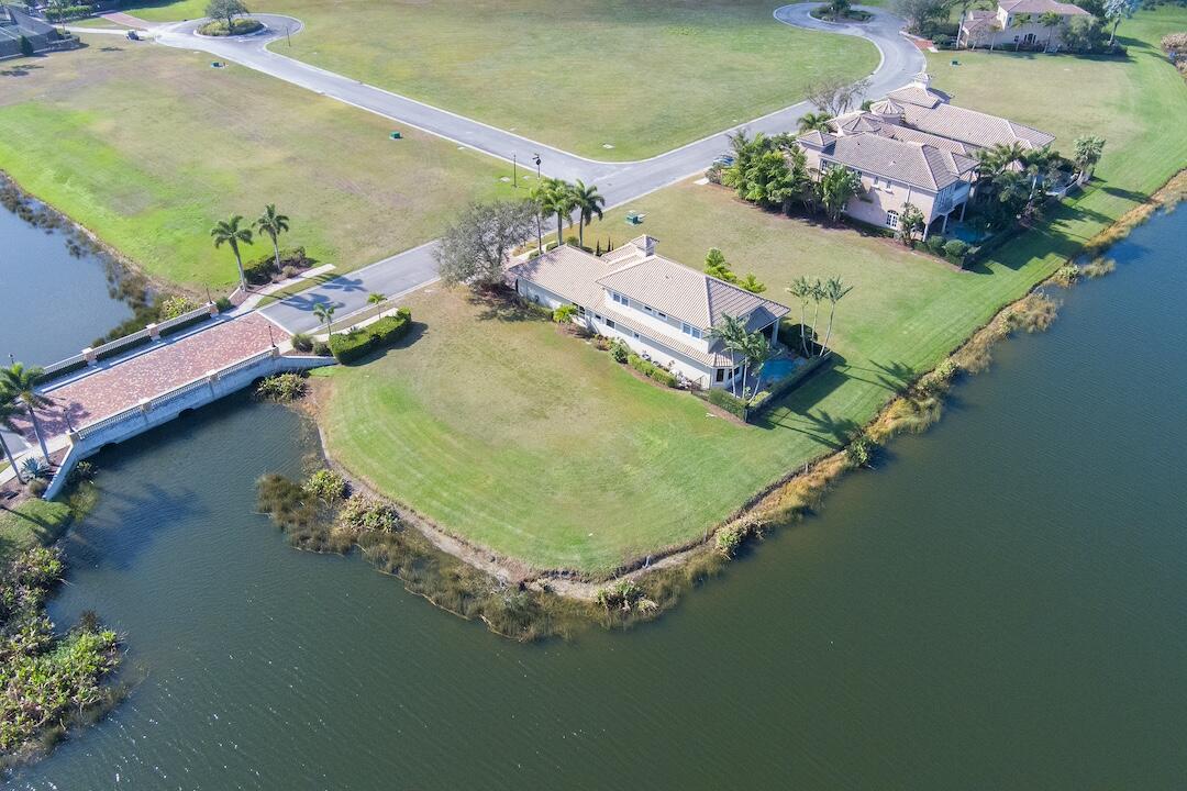Located within the gated golf community of Tesoro, this building site offers 175 ft of spring-fed lake waterfront, providing an ideal location for your future home. As the property owner, you have the opportunity to select a builder approved by Tesoro to design a home that perfectly complements the beautiful lake view. Tesoro's design guidelines allow for a variety of exterior styles, from Transitional to West Indies, Coastal Modern, and more. You also have the option to join the club as a voluntary member, where you'll be welcomed into a community that offers a wealth of amenities. Tesoro is guard gated community with roving security officers, so an appointment is need to view this idyllic home-site.