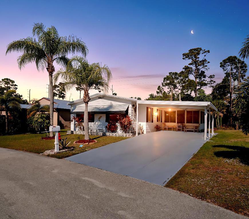 Welcome to Spanish Lakes, a popular 55+ community in Vero Beach. This furnished 2BR/2BA manufactured home features a bright, open layout with a spacious living room and plenty of natural light. The kitchen offers newer countertops, updated fixtures, and ample cabinetry. Updates include LVP flooring throughout, updated electrical and plumbing (2021), new faucets, washer & dryer (2021), and freshly painted interior and exterior. Major improvements include roof (2021), A/C (2020), updated tie-downs (2021), and skirting (2022). Located on leased land ($828/month). Spanish Lakes offers golf, fitness center, pool, pickleball, tennis, shuffleboard, library, and an active social lifestyle near shopping, dining, and beaches.