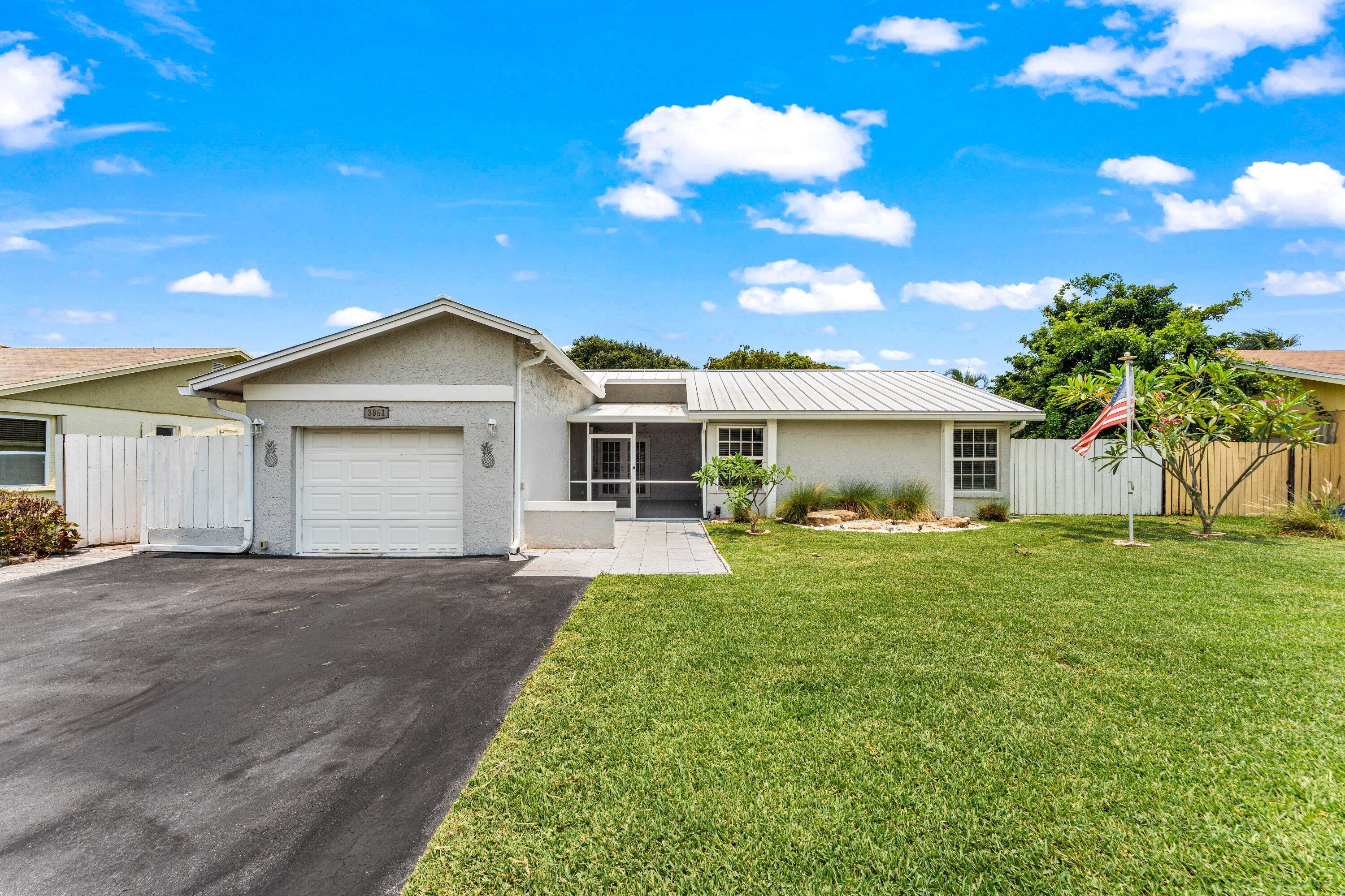 Welcome to this well-maintained 3-bedroom, 2-bath pool home in the Villages of Hillsboro; offering comfort and easy Florida living. The bright interior features spacious living areas and an updated kitchen with white cabinetry, butcher block counters, farmhouse sink, and stainless appliances. Enjoy year-round outdoor living from the large screened patio overlooking the private pool and fully fenced backyard. A long driveway and 1-car garage provide ample parking.  Nestled on peaceful streets with nearby parks and green spaces, the neighborhood offers a tranquil setting with easy access to cycling paths, shopping, dining, and everyday conveniences. Perfect for relaxing or entertaining!
