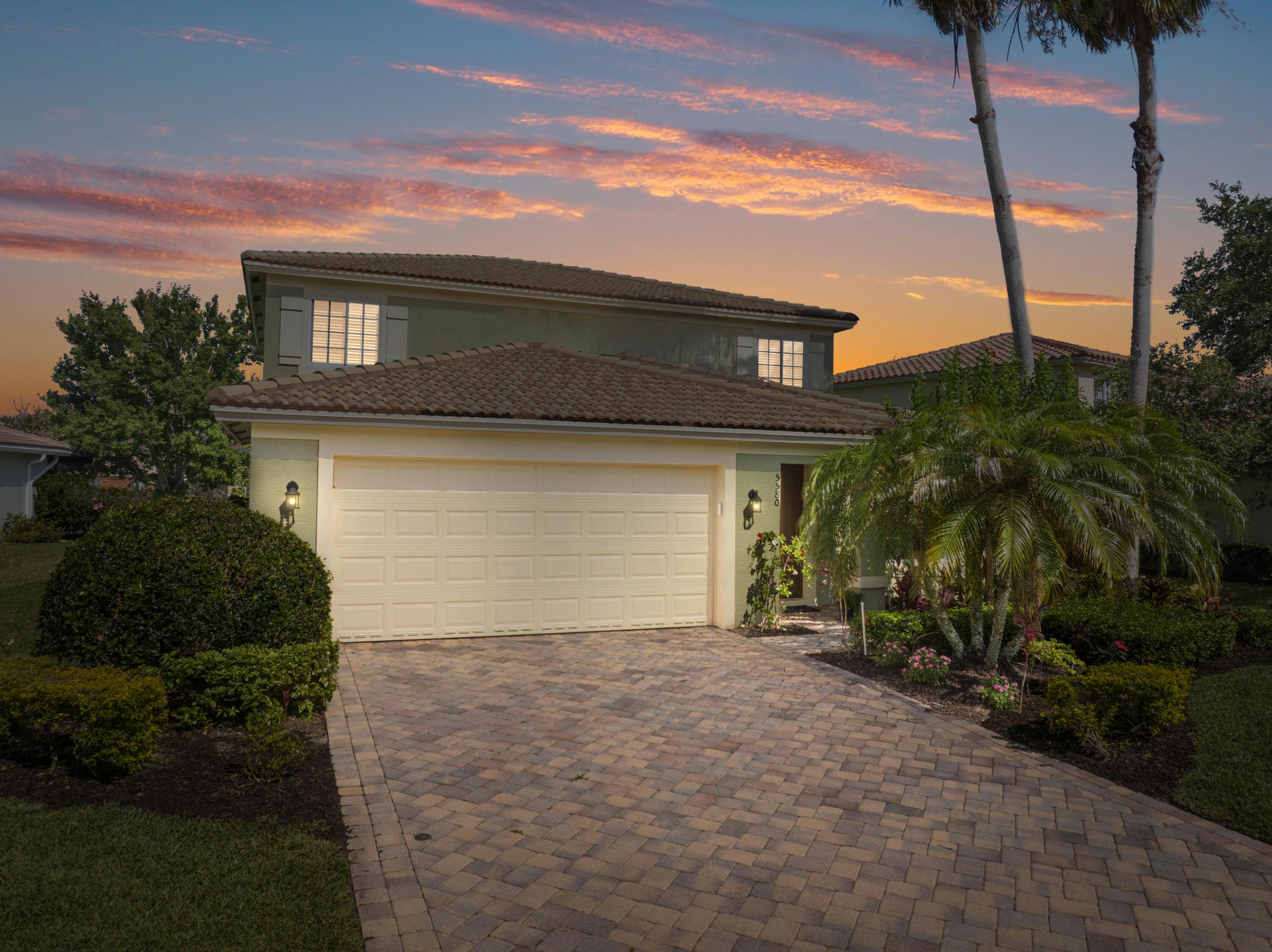 Nestled within the sought-after gated community of VeroLago, this spacious lakefront residence offers the perfect blend of comfort, convenience, and Florida lifestyle living in the heart of Vero Beach. Boasting a versatile layout with the primary suite conveniently located on the first floor, this beautifully maintained home features diagonal tile flooring, granite countertops, tile backsplash, multiple living spaces including both a formal living room and family room, plus an expansive upstairs loft accompanied by four additional guest bedrooms.  The oversized primary suite serves as a relaxing retreat with double vanities, a deep soaking tub, walk-in shower, and brand-new carpet. Thoughtful upgrades include new energy-efficient downstairs lighting with dimmers throughout most living areas, a newer refrigerator, and a February 2022 hot water heater. A convenient downstairs half bath makes entertaining guests effortless.  Step outside and enjoy peaceful lakefront views while being just minutes from everyday conveniences and some of the Treasure Coast's most desirable destinations. Located approximately 4 minutes from Publix, 8 minutes from Cleveland Clinic Indian River Hospital, and only about 12 minutes from Vero's pristine Atlantic beaches, this location provides quick access to shopping, dining, healthcare, and coastal recreation.  Residents of VeroLago enjoy resort-style amenities including a community pool, fitness center, tennis courts, and pickleball. The home is also offered fully furnished and decorated, negotiable for buyers seeking a seamless move-in-ready Florida retreat, seasonal residence, or investment opportunity.