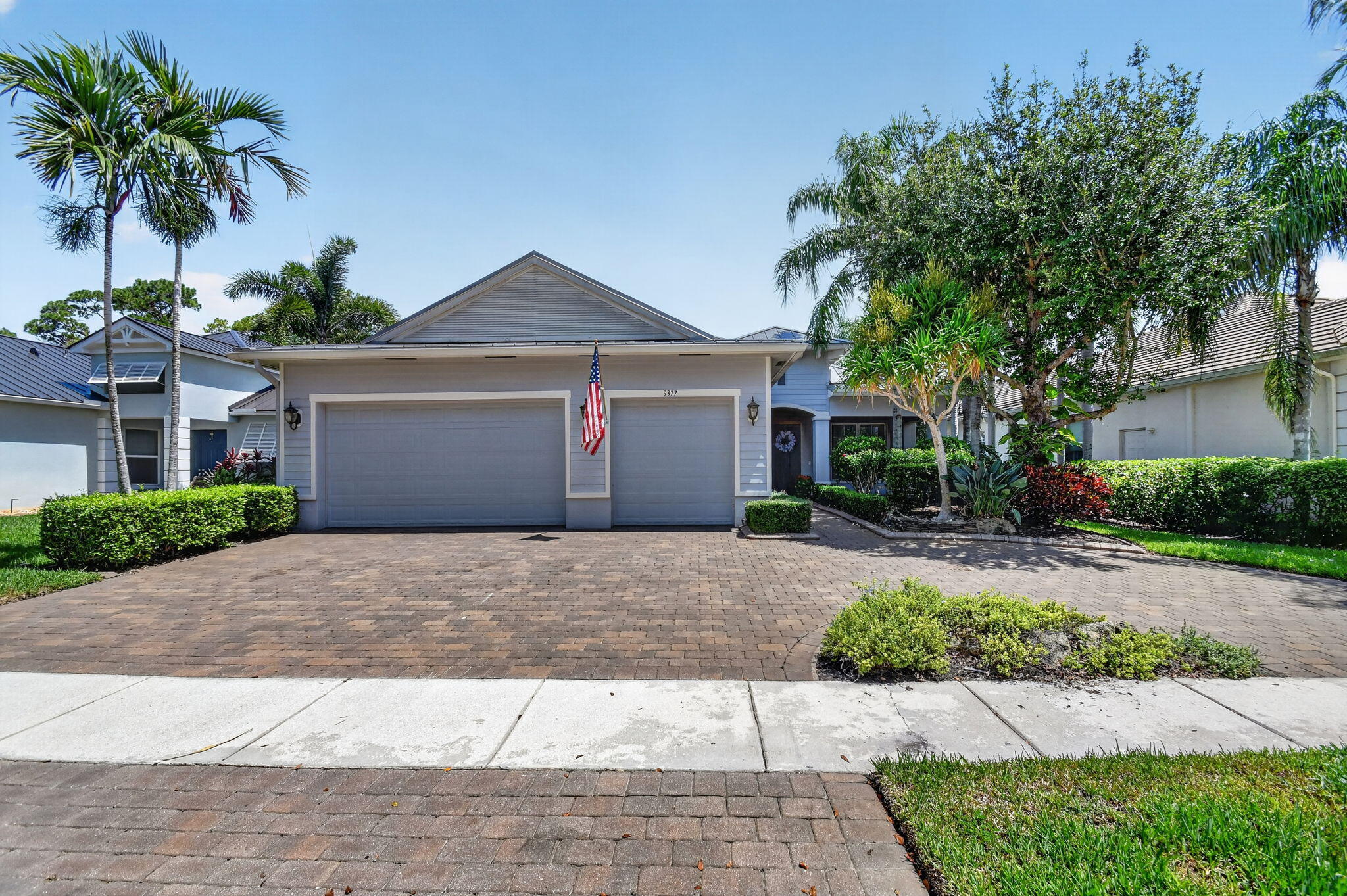 Welcome to one of Palm Beach County's most desirable gated communities, where beautiful curb appeal, resort-style living, and everyday convenience come together. This home sits on one of the prettiest streets in the neighborhood and makes a wonderful first impression with lush tropical landscaping, a spacious wrap around paver driveway, and an inviting double-door entry.  Inside, you'll find a bright and open layout with soaring ceilings, elegant archways, tile flooring, and generous living spaces designed for both comfort and entertaining. The kitchen features an oversized center island, rich cabinetry, granite countertops, stainless steel appliances, and plenty of storage and prep space, making it the true heart of the home.   Step outside to your private backyard pool oasis, complete with a screened enclosure so you can relax, entertain, and enjoy Florida living while keeping the bugs away. Whether you're hosting family and friends or enjoying a quiet evening by the pool, this outdoor space is built for year-round enjoyment.   Located in a highly sought-after, 24-hour guard-gated community with outstanding amenities, this home offers the lifestyle buyers are looking for. Enjoy access to A-rated schools and an unbeatable location close to the Turnpike, I-95, shopping, dining, entertainment, and the South Florida Fairgrounds. You can even take your golf cart to nearby concerts and events. This is a rare opportunity to own a beautiful home in one of the area's most loved communities.