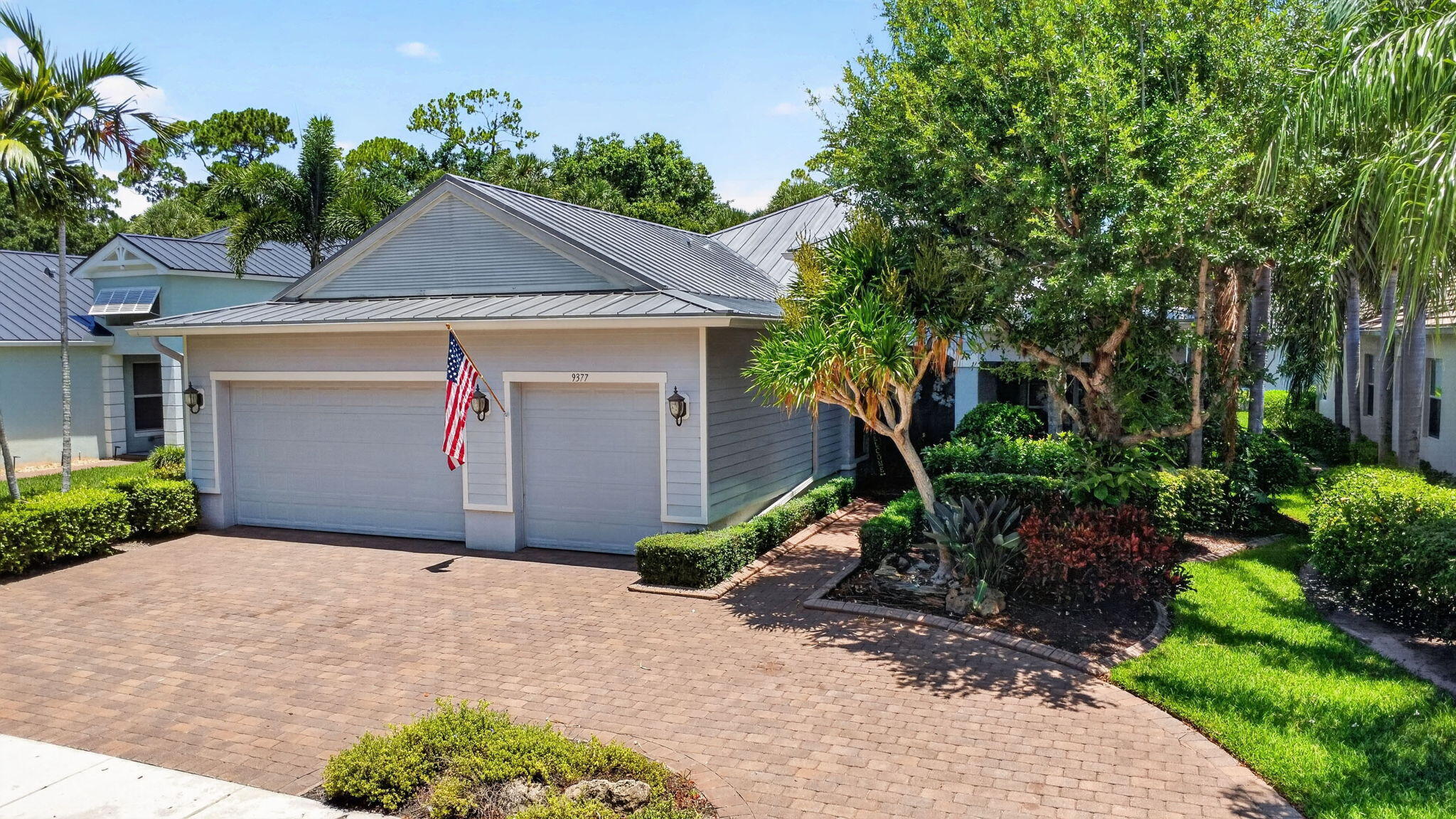 Welcome to one of Palm Beach County's most desirable gated communities, where beautiful curb appeal, resort-style living, and everyday convenience come together. This home sits on one of the prettiest streets in the neighborhood and makes a wonderful first impression with lush tropical landscaping, a spacious wrap around paver driveway, and an inviting double-door entry.  Inside, you'll find a bright and open layout with soaring ceilings, elegant archways, tile flooring, and generous living spaces designed for both comfort and entertaining. The kitchen features an oversized center island, rich cabinetry, granite countertops, stainless steel appliances, and plenty of storage and prep space, making it the true heart of the home.   Step outside to your private backyard pool oasis, complete with a screened enclosure so you can relax, entertain, and enjoy Florida living while keeping the bugs away. Whether you're hosting family and friends or enjoying a quiet evening by the pool, this outdoor space is built for year-round enjoyment.   Located in a highly sought-after, 24-hour guard-gated community with outstanding amenities, this home offers the lifestyle buyers are looking for. Enjoy access to A-rated schools and an unbeatable location close to the Turnpike, I-95, shopping, dining, entertainment, and the South Florida Fairgrounds. You can even take your golf cart to nearby concerts and events. This is a rare opportunity to own a beautiful home in one of the area's most loved communities.