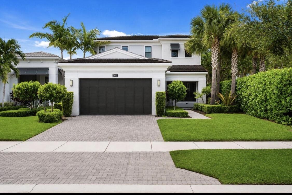 This modern & bright Francesca model is located in the BEST corner lot in one of Palm Beach Gardens' most sought-after newer communities: ARTISTRY! This beautifully upgraded & freshly painted (interior & exterior) residence offers 3,155 square feet of living space with 3 bedrooms plus a spacious loft, 3.1 bathrooms, 2 car garage and a thoughtfully designed floor plan featuring the primary suite on the main level.  The main-floor primary retreat includes a custom organized walk-in closet, built in electric fireplace and a large ensuite bath with a new vanity, a soaking tub, and a separate walk-in shower. The main level also features a conveniently located laundry room, elegant white tile floors, custom wood trim & finishes, and stylish new fans & fixtures throughout. The spacious kitchen is designed for both everyday living and entertaining, offering sleek white cabinetry, stainless steel appliances including a gas stove, elegant backsplash, quartz countertops, a breakfast area, and seamless flow into the dining area and separate living space. Large impact windows and doors fill the home with natural light, while the living area opens to a covered lanai and private backyard. Upstairs, a newly finished wood staircase leads to the second level, featuring new wood floors, a generous loft, and additional 2 bedrooms with no carpet throughout. The fully fenced backyard has been newly finished with turf grass and enhanced with private landscaping, creating a low-maintenance outdoor space ideal for relaxing, entertaining, or enjoying the South Florida lifestyle. With all impact windows and doors, a brand-new water heater, modern finishes, a flexible layout, and a prime Palm Beach Gardens location close to the best beaches, restaurants, & shopping malls; this Francesca Model offers the perfect blend of luxury, comfort, and convenience.