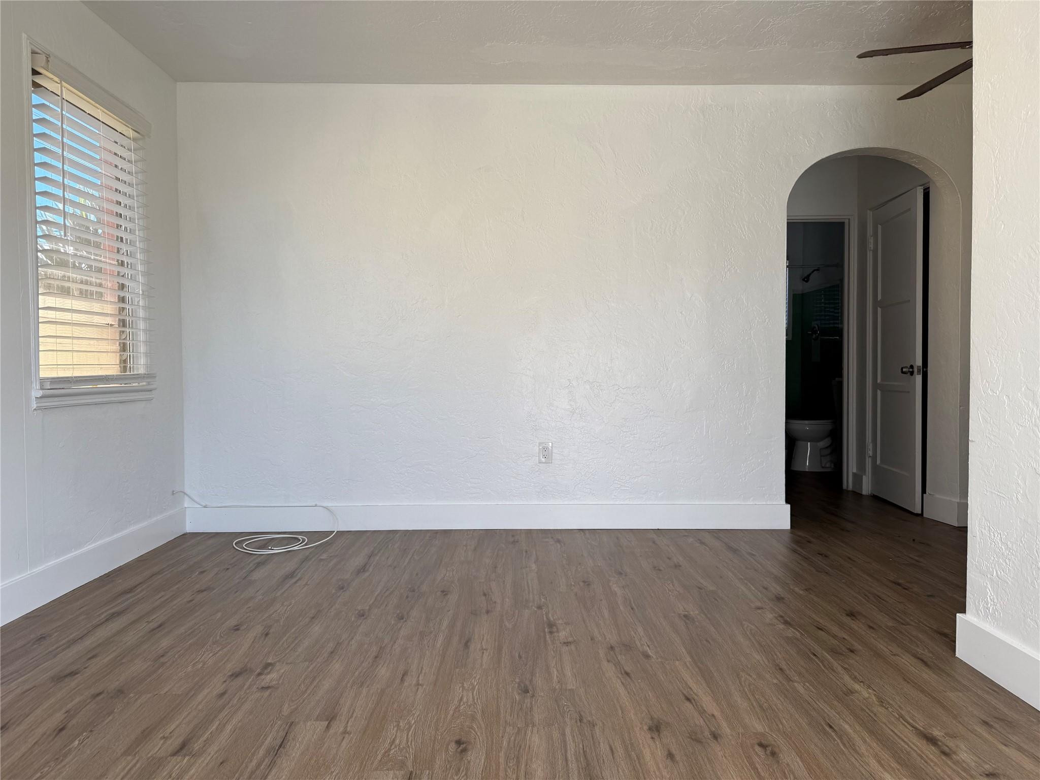 See this spacious, updated 1-bedroom apartment in Hollywood! This unit features beautiful Spanish tile throughout, the living area is bright and airy, with ample natural light streaming through the large windows, perfect for abundant light. The kitchen is equipped with modern appliances, including a stove and refrigerator, complemented by sleek cabinetry. The bathroom is pristine with stylish white tiles and updated fixtures. Outside, the charming yellow exterior and lush green surroundings add a cheerful vibe to the property. This unit is conveniently located close to shopping, dining, and public transportation, making it an ideal choice for those seeking comfort and convenience. Don't miss this opportunity to make this lovely space your new home!