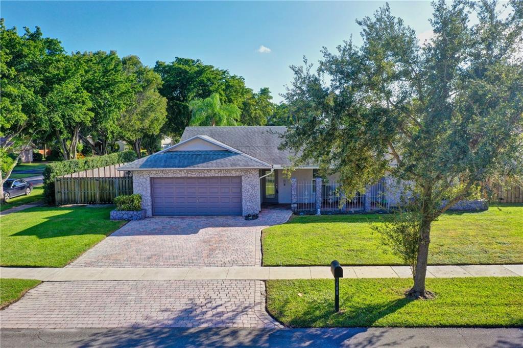 Gorgeous & Completely Remodeled Plantation Home "For Sale" in The Exclusive Plantation Hills Neighborhood-Large Corner Lot- Everything New Inside: Owner Spent Over **$100k in Interior Upgrades** this year. Brand New "State of the Art" Kitchen w/Expensive Quartz Counter Tops High-End Cabinets & New Stainless Steel Appliances-New Tiled Flooring-Bathrooms Tastefully Remodeled-LARGE Master Suite w/Walk-in Closets-Newer Hurricane Impact Doors/Windows-Covered Rear Patio w/Swimming Pool - w/Brick Paved Driveway & Additional Side Parking (Behind Gate) on Concrete Slab will fit Boat/RV/Trailer - No Home Owners Association