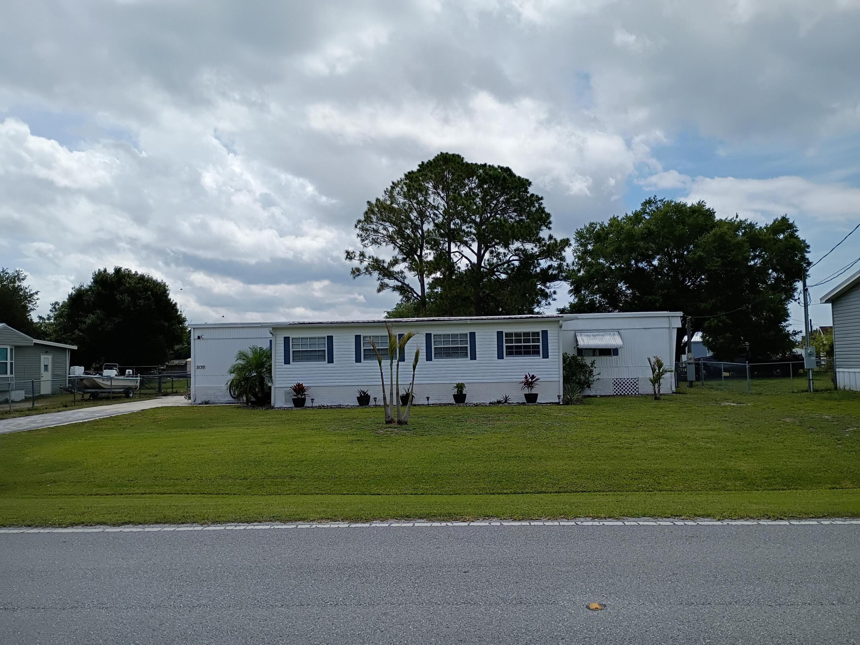 Welcome to this charming three-bedroom, two-bathroom single-story residence nestled in the Taylor Creek Isles community of Okeechobee, Florida. This well-proportioned home offers 1335 square feet of finished living space, providing comfortable and efficient quarters for everyday living. The straightforward layout and manageable size make this property an accessible option for those seeking a practical residence. Located in the established Taylor Creek Isles subdivision, this single-family home presents a solid opportunity for buyers looking to establish themselves in the Okeechobee area.