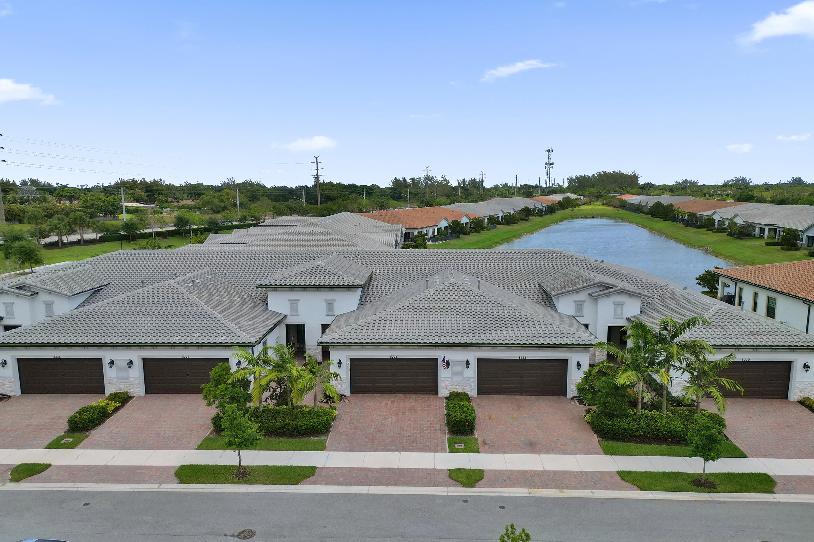 BREATHTAKING 55+ 3/2/2 VILLA IN "THE FALLS OF PARKLAND". START YOUR MORNING OVERLOOKING THE LAKE WHILE SIPPING YOUR COFFEE. OVERSIZED OPEN KITCHEN WITH GAS STOVE & ISLAND! GAS BBQ & HWH WITH INSTANT HOT PUMP. MAIN BEDROOM WITH LAKE VIEW, DBLE VANITY BATH, STEP IN SHOWER & LARGE WALK-IN ORGANIZER CLOSET. COMPLETELY UPGRADED WITH QUARTZ COUNTERS -THRU-OUT, IMPACT WINDOWS & DOORS, GENERAC GENERATOR, CLOSET ORGANIZERS IN EVERY ROOM & PANTRY, TILE THRU OUT LIVING AREAS & WATERPROOF LAMINATE EACH BEDROOM. RING DOORBELL ON FRONT DOOR, BACK PATIO, & DRIVEWAY, EPOXY GARAGE FLOORING, CEILING FANS THRU-OUT! LIST GOES ON & ON. CLUBHOUSE HAS IT ALL, CAFE, PICKLEBALL, SWIMING POOL & SPA. CLOSE TO RESTAURANTS, SHOPPING, HWYS. THIS HOME IS WORTH SEEING!
